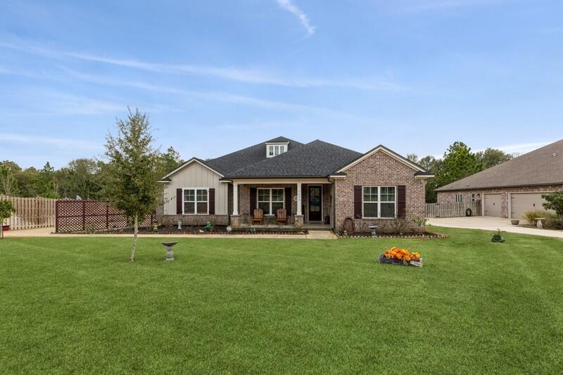 Gorgeous 4 bed /3bath home with flex room located in Mill Creek Farms in Baker.  Chef's kitchen with oversized refrigerator/freezer, 2 islands, double oven, and built in wine fridge/coffee bar.  Upgraded quartz countertops, crown molding and lvp floors throughout.  Owner's bathroom has a jetted tub, 2 closets and tile and river stone shower. Home boasts custom barn doors and some plantation shutters.  Home has an extended back porch and both the front and back porch have new ninja concrete flooring.  Additional concrete pad allows for 6 vehicles to easily park in the driveway.  Ring security system with outside cameras. Back yard has been cleared and fenced.  Solar panels currently make the utility bill around $20 per month.  No need to worry about skyrocketing power bills with this home.