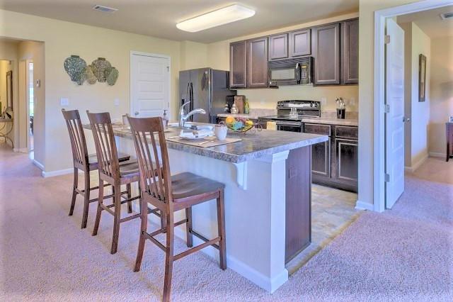 The Aria is a one story floor plan featuring 3 bedrooms, 2 baths, covered back porch & 2 car garage. The open kitchen features an island, stainless appliances and granite countertop. The kitchen opens to the great room w/ access to the covered porch. The master suite is just off the back side of the house & master bath features a separate shower, walk in closet, dual sinks & large soaking tub. Pictures, photographs, colors, features, and sizes are for illustration purposes only & will vary from the homes as built. Home & community information including pricing, included features, terms, availability and amenities are subject to change and prior sale at any time without notice or obligation. Estimated completion is Feb/March