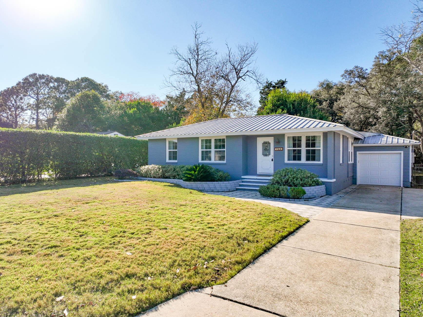 Beautifully renovated 3 bed/2 bath Florida cottage in desirable Garnier's Beach neighborhood with a community park for swimming or boat launch in Garniers Bayou-leads to Bay. Easy access to both Eglin AFB and Hurlburt Field.   Original wood floors throughout have been restored.  Updated Eat-In kitchen features a granite center island, stainless appliances, white cabinets, chandelier and rustic lights.  Enjoy relaxing on the 25' x18' covered back patio.  Open concept floor plan. Use the Flex area located between living area and kitchen as a dining room, den, media room, home office or playroom.   Home has plenty of natural light as each room has at least 2 large windows.  Home is brick in front and hardi-board in the back. Fenced in back yard for privacy. Single garage plus laundry/storage.