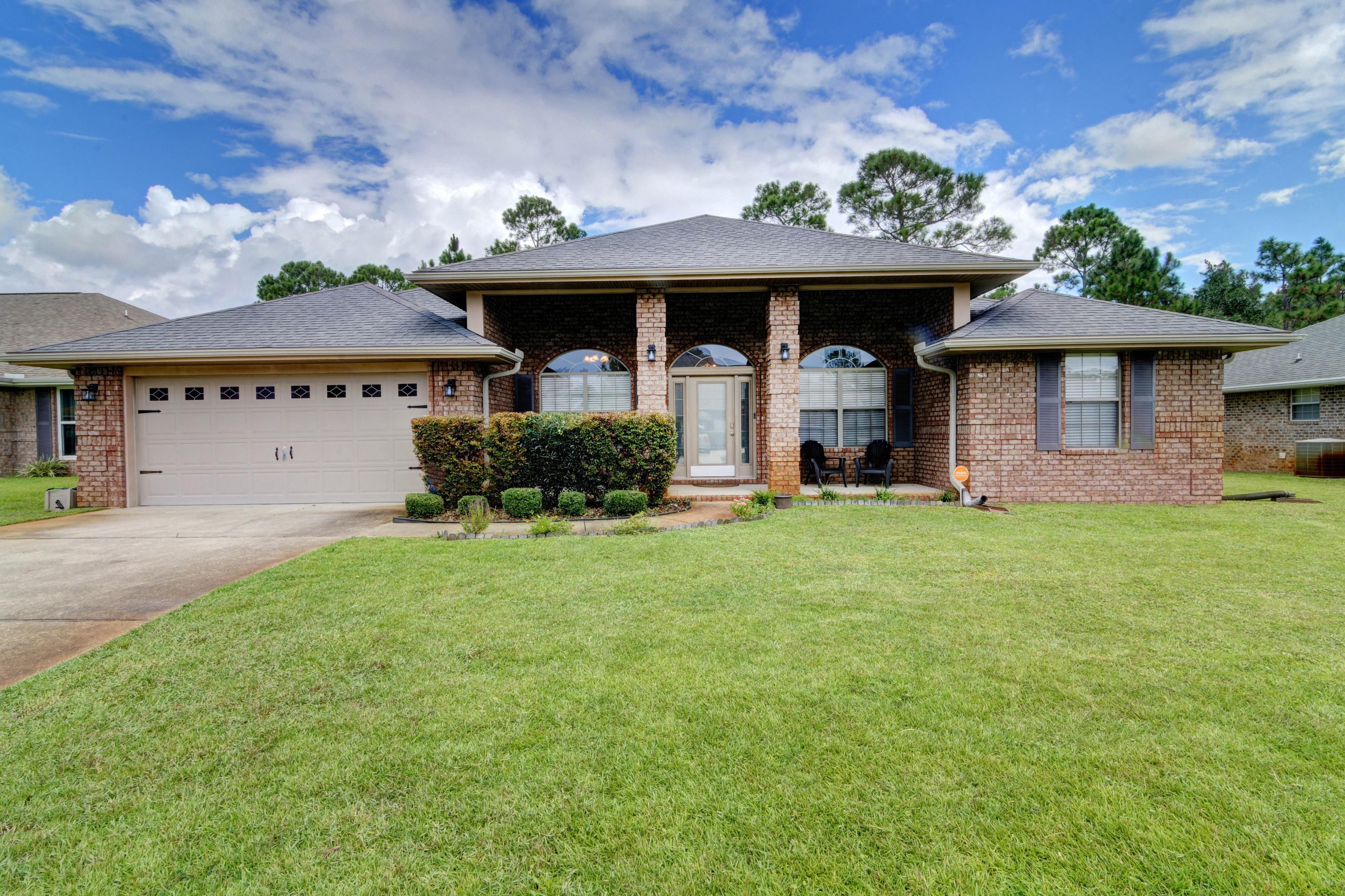 Welcome home to this stunning and updated 4 bedroom east Navarre all brick retreat! Here you'll find all the space you're looking for because in addition to 4 true bedrooms, you'll love that this floor plan features two additional flex rooms on either side of the front door! Perfect for a formal dining room, play room, office, etc - the possibilities are endless! Enjoy updated finishes like bullnose corners, orange peel ceilings, granite counters in the kitchen as well as both bathrooms, and luxury plank flooring! Pull up the front driveway and appreciate the gorgeous landscaping and curb appeal, and take in the expansive front covered patio! Enter inside and you'll find the two flex rooms on either side complete with newly installed luxury vinyl plank flooring that also extends throughout the spacious living room. The kitchen features maple cabinets, granite countertops, pantry, and stainless appliances, and the tasteful space is open to an additional eat in kitchen space complete with the luxury plank flooring. The split floor plan showcases a huge master bedroom on one side with a trey ceiling, and the master bathroom is the perfect space to relax after a long day with a separate soaking tub and stand up shower, along with double granite vanities and two walk in closets. This fantastic floor plan allows for one of the guest bedrooms to have more privacy on one side of the living room, and the other two are found on the other side with a bathroom in between. You'll love the large backyard with covered patio! Current survey available. Don't delay on coming to see your new home!