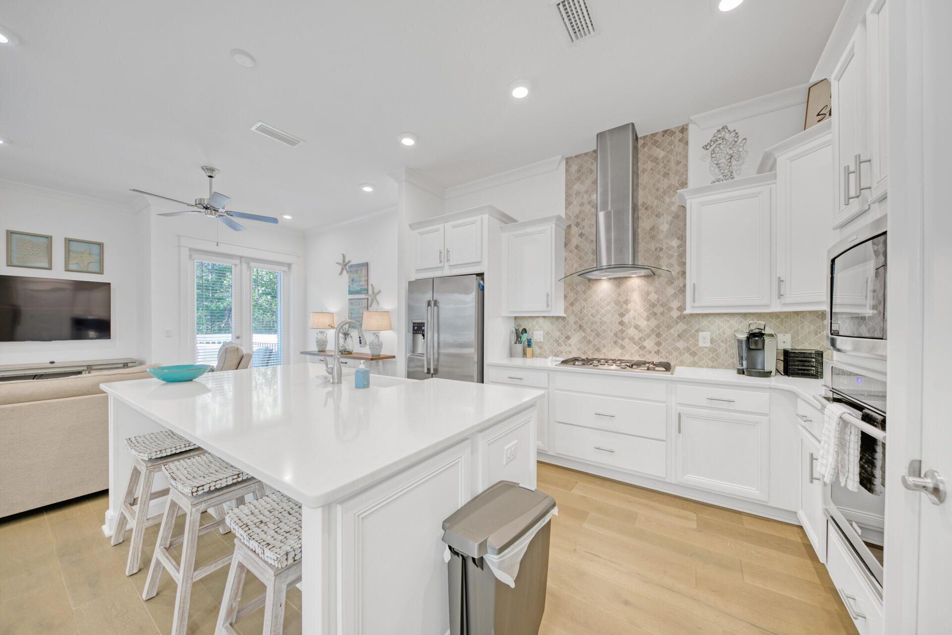 Coveted private location in Prominence! This beachside residence backs up to Deer Lake state park. This spacious Bahama plan features a 2 car garage, large porch, high ceilings, upgraded appliances and wood flooring throughout.   Professionally furnished & rental ready.