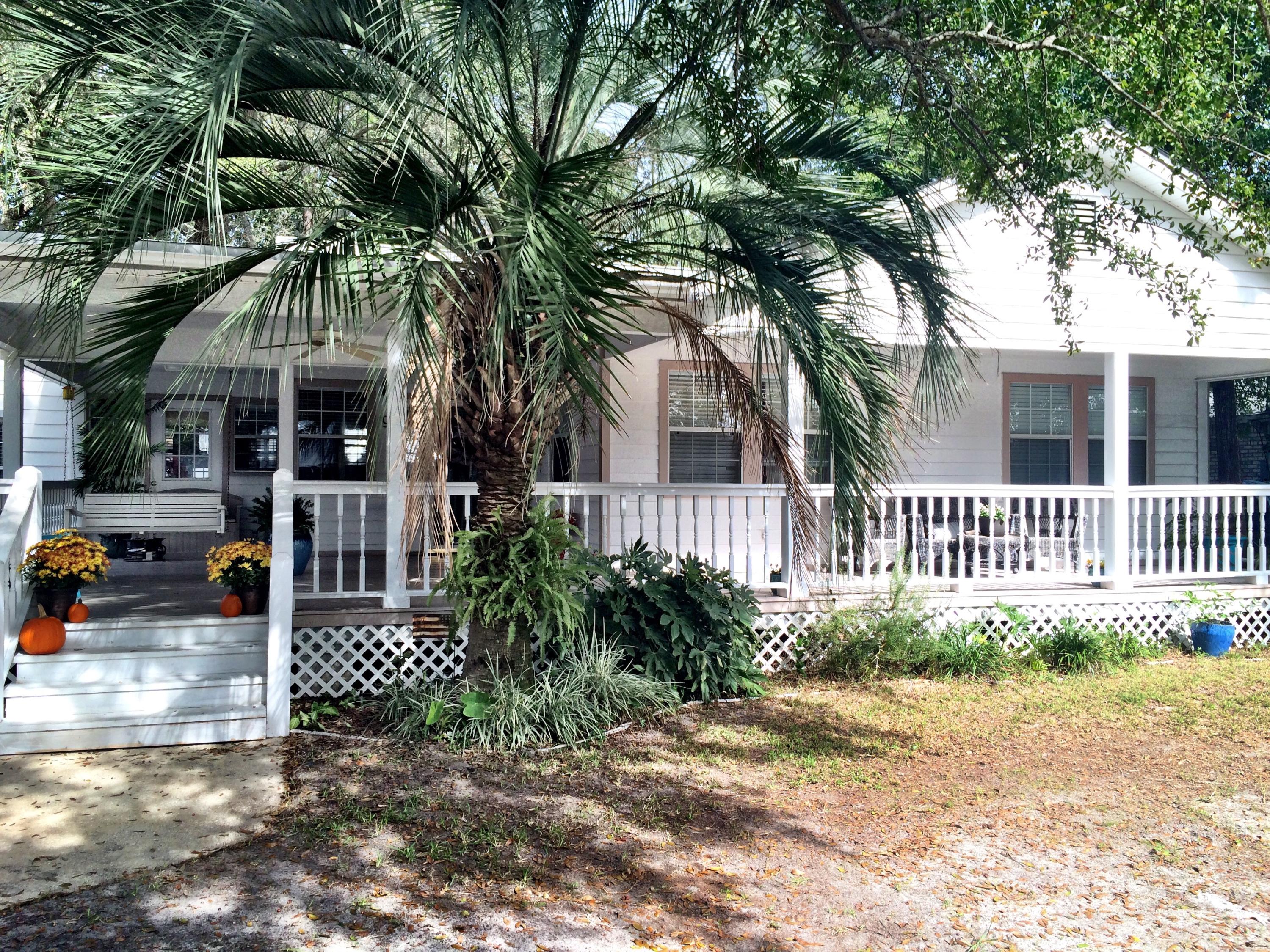 The most charming florida home with modern amenities you will find. Incredible front porch with swing and room for entertaining. The open concept living, dining, and kitchen areas are perfect for today's homeowner. Stainless steel appliances with new dishwasher and a new gas range in this spacious and bright kitchen. Easy breezy laminate flooring in the living areas and hardwood floors in the bedrooms. The den is a comfortable retreat with a gas start fireplace. The master bedroom features a large walk-in closet and updated vanity in the bathroom. Elegant rosette molding throughout the home. Don't let the age of the home fool you; the wiring, plumbing & walls were updated in 1993. Beautiful neighborhood featuring a park with dock, picnic table, and doggy station just steps from your door. The large backyard is perfect for kids and pets and has a storage shed (with electricity).  Walking distance to school and shopping.  Very convenient to Eglin AFB and Hurlbert Field.  Plenty of room to park your RV and/or vehicles.