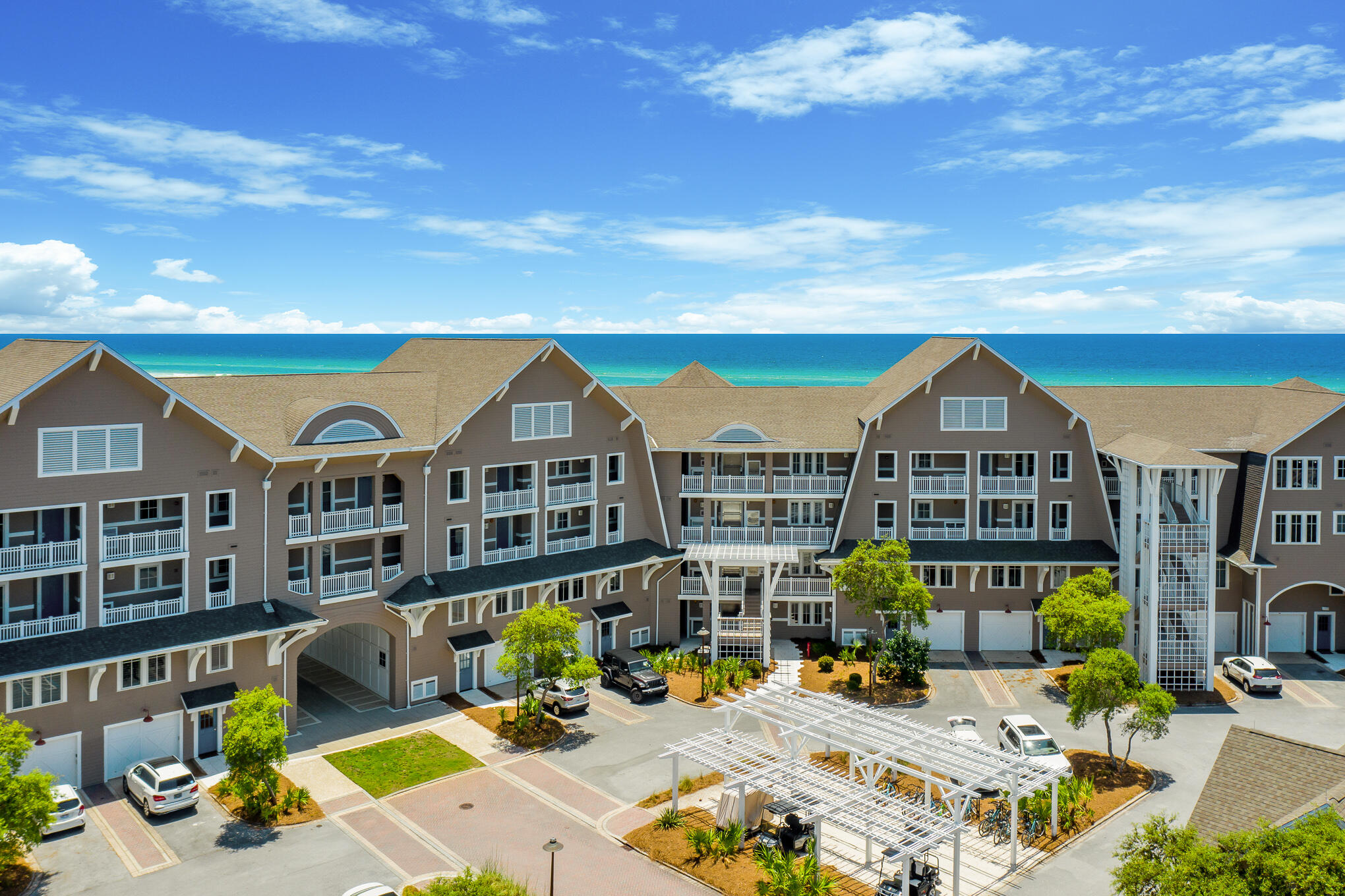 Priced $600K under recent appraisal and designed by the acclaimed Graham Gund Architects, Compass Point II emulates the coastal Nantucket architecture found throughout WaterSound Beach. With only twenty-five residence style units, the low-density complex is strategically positioned behind the crystalline white sandy beaches and established dune vegetation offering short views of the local habitat and long views out to the sea. Residence 107 features the U1 configuration encompassing nearly 2,500 square feet of thoughtfully planned living space on one single level in addition to a one-car garage.

The three-bedroom unit has been recently transformed featuring a host of desirable upgrades. Throughout the entire space, hardwood flooring and wainscot paneling add a touch of timeless eleganc The thoughtfully equipped kitchen showcases luxury appliances, guaranteeing a superior level of culinary convenience. Abundant natural light bathes each room, courtesy of floor-to-ceiling windows adorned with classic plantation shutters. The primary bedroom, complete with a walk-in closet, provides a particularly private and spacious retreat. The open-plan living and dining room exude understated elegance, featuring built-ins that offer both desk space and storage. The focal point of this space is the octagonal-shaped bay, adorned with several doors opening onto the expansive screened porch.

WaterSound Beach resides on 1,400 acres and over a mile of private Gulf frontage. The culmination of amenities and exclusiveness affords residents with the epitome of private coastal living while remaining geographically poised near the world-class dining and entertainment venues 30A has to offer. Notable amenities include a heated community swimming pool, fitness center, pedestrian bridges, and multiple community parks. 2021 Golf Cart with new lithium batteries is also included with the sale. Inquire today to schedule a private viewing and start living the coastal lifestyle you deserve.