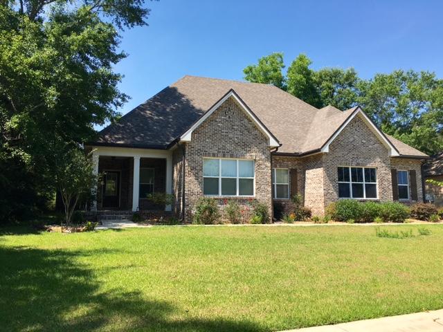 Country living near Baker! Come see this lovely 4BR/2BA home with lots of upgrades! Pull up to a side entry garage, sidewalk to the front porch with columns and entry into the family room with raised ceilings, wood floors and open to the roomy, well equipped Kitchen with large island, lots of cabinets, and storage. Home also has a surround sound system and a gorgeous master bedroom with Jacuzzi bath tub, separate shower and large walk in closet. Three additional bedrooms and full bath. Outside you have a screened room, a large privacy fenced yard with sprinkler system. Pet considered case by case. Alarm system as well, at tenant's cost if they choose to use.