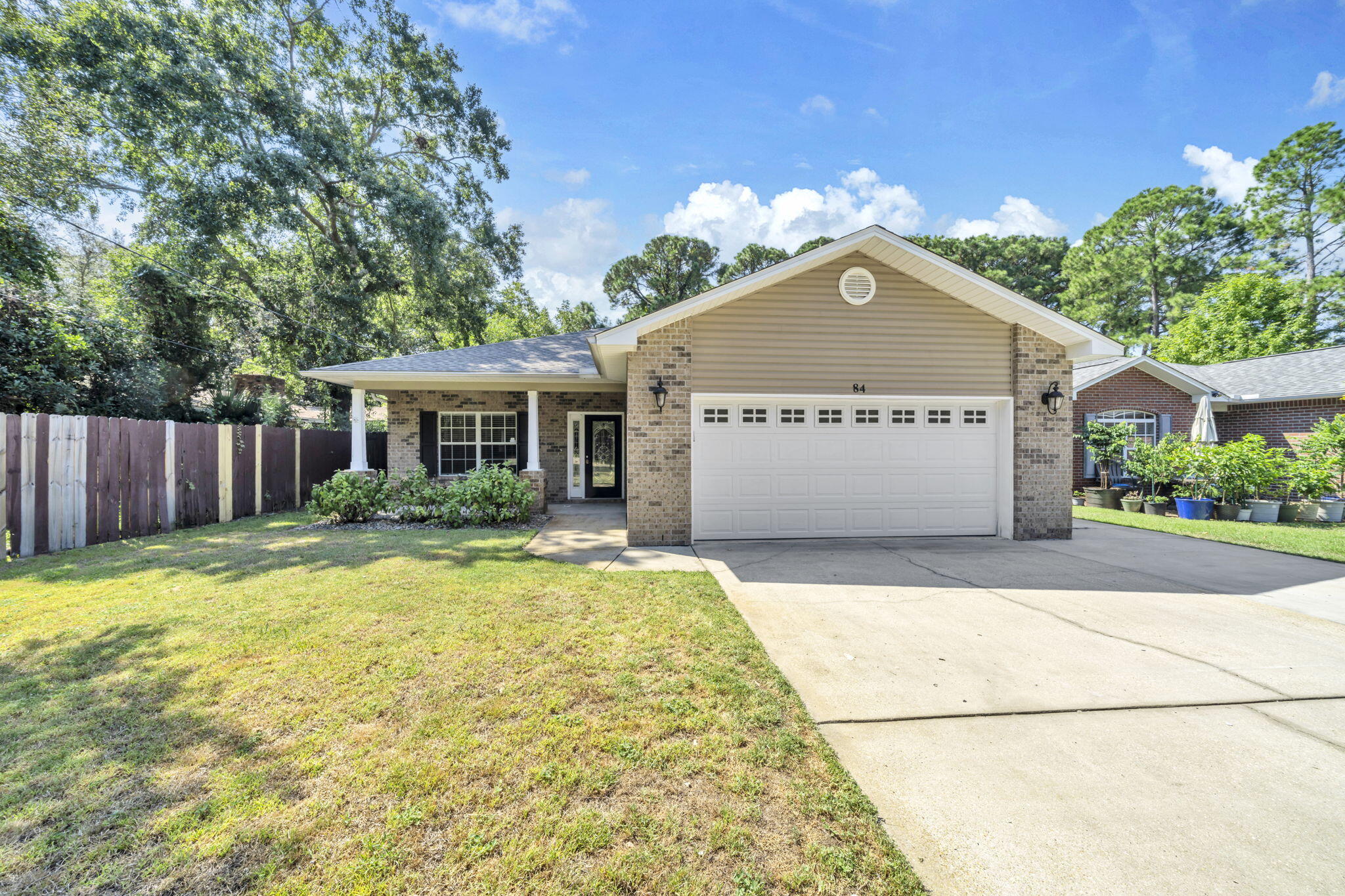 COMFORTABLE FLORIDA LIFESTYLE & EVERYDAY CONVENIENCE, top it off with  an ASSUMABLE 2.25% VA LOAN and NO-HOA!  PLUS 2025 HVAC, 2024 ROOF & TANKLESS GAS WATER HEATER. Positioned in close proximity to Hurlburt Field and Eglin AFB, it blends functionality and outdoor enjoyment in a way that perfectly suits busy lifestyles.  From the decorative glass entry, you're greeted by an inviting open floor plan that connects the dining, kitchen, and living areas. The dining room's trey ceiling and oversized window flood the space with natural light, while the kitchen delivers plenty of room to gather, with granite counters, a gas range, breakfast bar, and recessed lighting. The spacious living room easily becomes the heart of the home—whether for movie nights or hosting guests. The primary suite serves as a relaxing retreat with double vanities, a soaking tub/shower combo, andand generous storage. Three additional bedrooms plus two more baths provide flexible options for guests, hobbies, or a home office. Step outside, and you'll find plenty of space to enjoy the Florida lifestyle. A screened-in patio opens to a large fenced backyardideal for pets, play, and backyard barbecues. An outdoor kitchen and fire pit create year-round opportunities for entertaining. The widened driveway with full RV hookup makes it easy to park your boat, camper, or extra vehicle, ensuring there's room for all of life's adventures. With thoughtful upgrades and a prime location offering convenient access to schools, parks, and military bases, this home is more than just a place to liveit's a place to thrive.