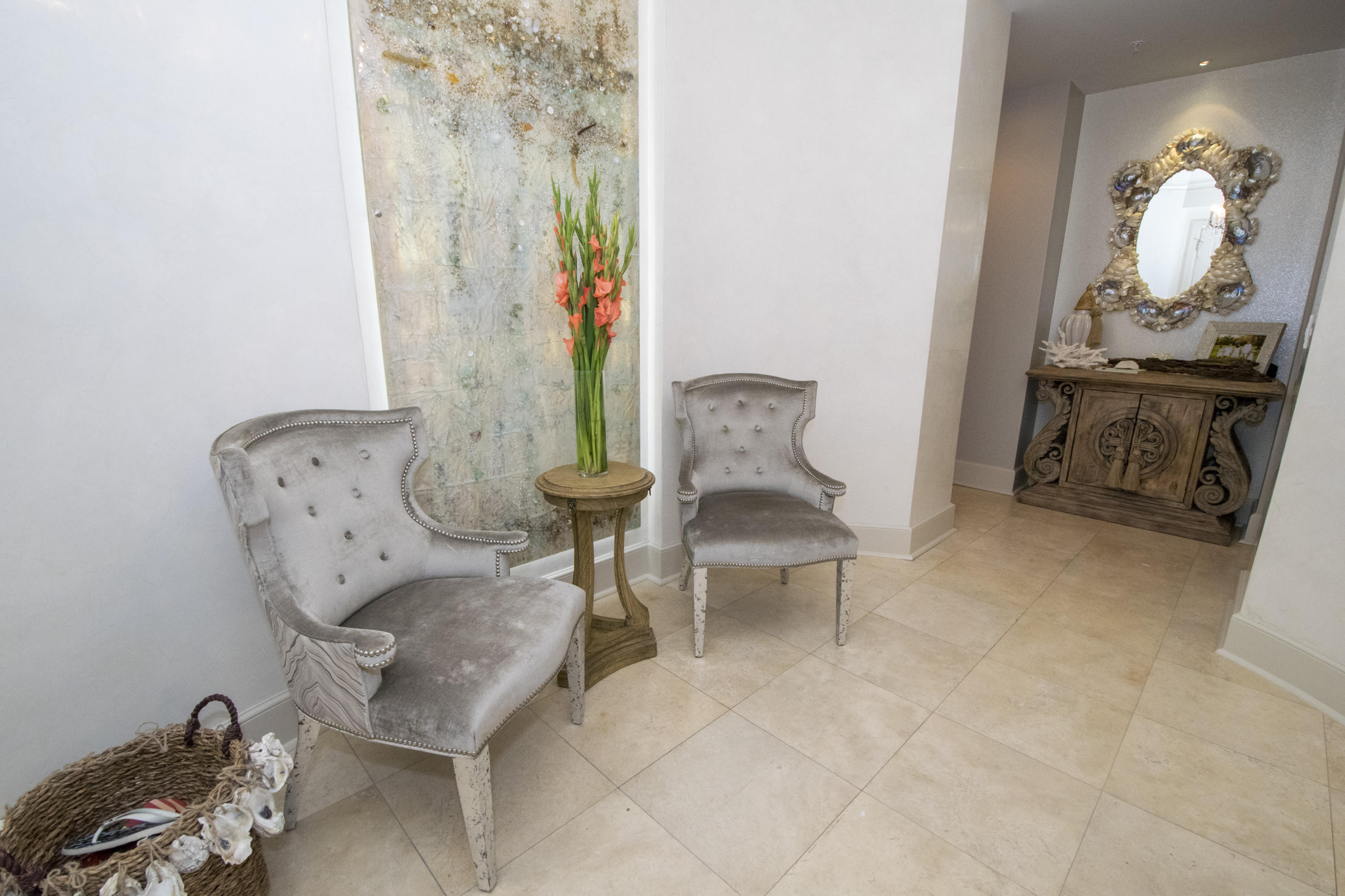 This is the most stunning condominium residence available on 30A. This gorgeous top floor home offers luxury and comfort with an open flow for living at the beach. THIS HOME IS A MUST SEE !! From the moment you enter, you will be in awe of the thoughtfulness and beauty it offers. Direct Gulf-Front and lake views from the living room, kitchen, dining room, and master bedroom and bath. This home has been fully renovated and professionally decorated by Lovelace Interiors, the owners have spared no expense in their attention to details. The home features four bedrooms, four baths 10 foot ceilings, a fabulous chef's kitchen with top of the line Viking appliances and birchwood custom cabinetry. The exquisite kitchen ceiling, backsplash and wall to separate bar area are adorned with hand laid crushed sea shells. The dining and living area are decorated with custom furnishings in lovely neutral tones blending and accenting the views of the Ocean.   The oversized master bedroom offers balcony access while the master bathroom has a copper soaking tub  double vanities and a temperature controlled steam shower.  The master bath also has a unique pearlized papered ceiling with sea shell glass tiles on back splash and wall.  The master closet is a "dream" space with custom walled mirrored doors throughout.  Additional amenities in the home include a wet bar area and three spacious guest bedrooms each with an en-suite bath and each professionally decorated.  Great laundry room with plenty of room for storage and a separate "drop zone" for purses and bags.  As a very Special Bonus; the owners have their own private poolside cabana which is included in the sale of this home.  This air conditioned poolside cabana houses a full living/bar area and separate full bathroom.

Sanctuary by the Sea is a gated community nestled on 23 pristine acres with 650 feel of Gulf frontage and only 82 luxury residences overlooking the Gulf of Mexico and one of our rare coastal dune lakes, Redfish Lake.  The amenities are endless offering 3 swimming pools with pool-side Cabanas, waterfalls, fountains, outdoor hot tubs, community fire pits, Viking BBQ grills, a Gulf-front owners's lounge state-of-the-art fitness center, virtual golf simulator, high-tech video/arcase.  Sound sound movie theater, enclosed parking garage, owners storage closets, 24 hour security and elegant tropical "oasis" landscaping throughout!