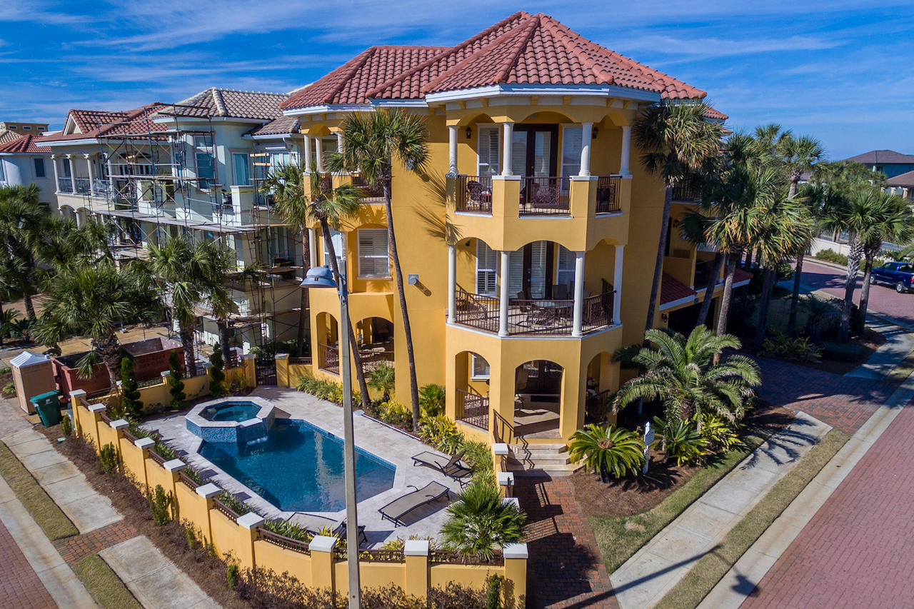 Sweeping gulf views from the 1st tier in prestigious Destiny by the Sea. The beloved, award winning Tuscan Villa is a visual masterpiece, combining modern design with old world architecture, influenced by Italy and the Mediterranean. With 7 balconies, you're sure to find a private retreat to relax and enjoy captivating views of the emerald gulf waters. With room for a crowd, this stately 5 bedroom, 5.5 bath home has it all: stunning Jerusalem stone floors, chef's kitchen, and a residential elevator to all floors. Plus a stone & tile accented new pool & spa, complete with tanning ledge. Outstanding rental history earning $143,600 in 2016. Perfect for large families and entertaining, the dining and living room areas are open to the kitchen. With granite counters, stone backsplash, pantry, wine cooler & stainless steel appliances, the Gourmet Kitchen is a true chef's dream. The third floor Master Suite offers a fireplace, wet bar, refrigerator and a luxurious en suite with spa tub and separate shower. Destiny by the Sea is an elite gated community located right on the Gulf of Mexico in central Destin, just minutes away from shopping, dining and Florida's largest charter fishing fleet. Enjoy Tuscan Villa for a never-ending, unforgettable vacation experience for you and your guests.