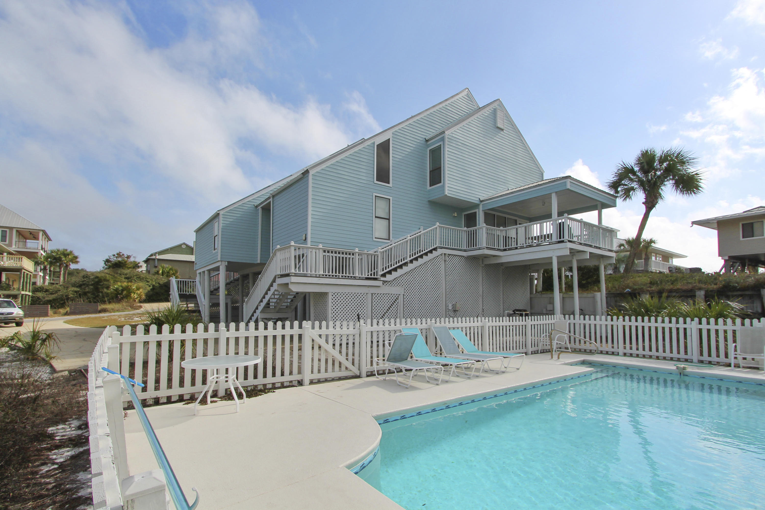 This property is a duplex with the same owner of both units ! Fantastic location one lot removed from the beach and with tremendous ocean views from every room.
West side is 4 bdrm/ 2 1/2 bath and the East side is 2 bdrm/ 2 bath. Nice private pool compliments this excellent property. Beach access is apprx. 100 steps away.