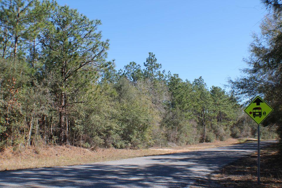 Paved Old River Road and Backs up to water management at Yellow River! High and dry with creek at the back! Deer, turkeys galore! The country is calling! Come see this beautiful, tucked away piece of land! There are plenty of trees for shade. Tons of room for your dream home. Bring you Barn and House Plans, Come make this yours today!