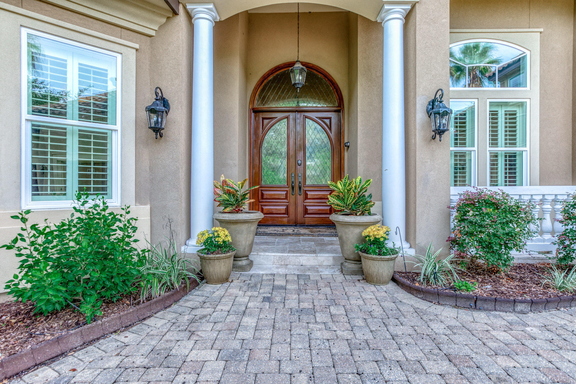 Stunning Mediterranean Home, in the exclusive gated community of Kelly Plantation. This home is extremely well designed for a large family. The home is located in one of the most sought after large family friendly circles of Kelly Plantation. The house sits next to the secluded park back entrance. You can walk to the tennis courts, basketball courts, playground, dog park, volleyball court and open play area. The oversized lot is fenced and backs up to a nature preserve and the park.
Besides the location, you will be amazed at the open concept entry way and living space. This split bedroom house has two Master Suites. The upstairs has a bonus room, bedroom, bathroom and coffee bar. Enjoy the heated pool, hot tub and outdoor cooking area.  Buyer to verify Dimensions