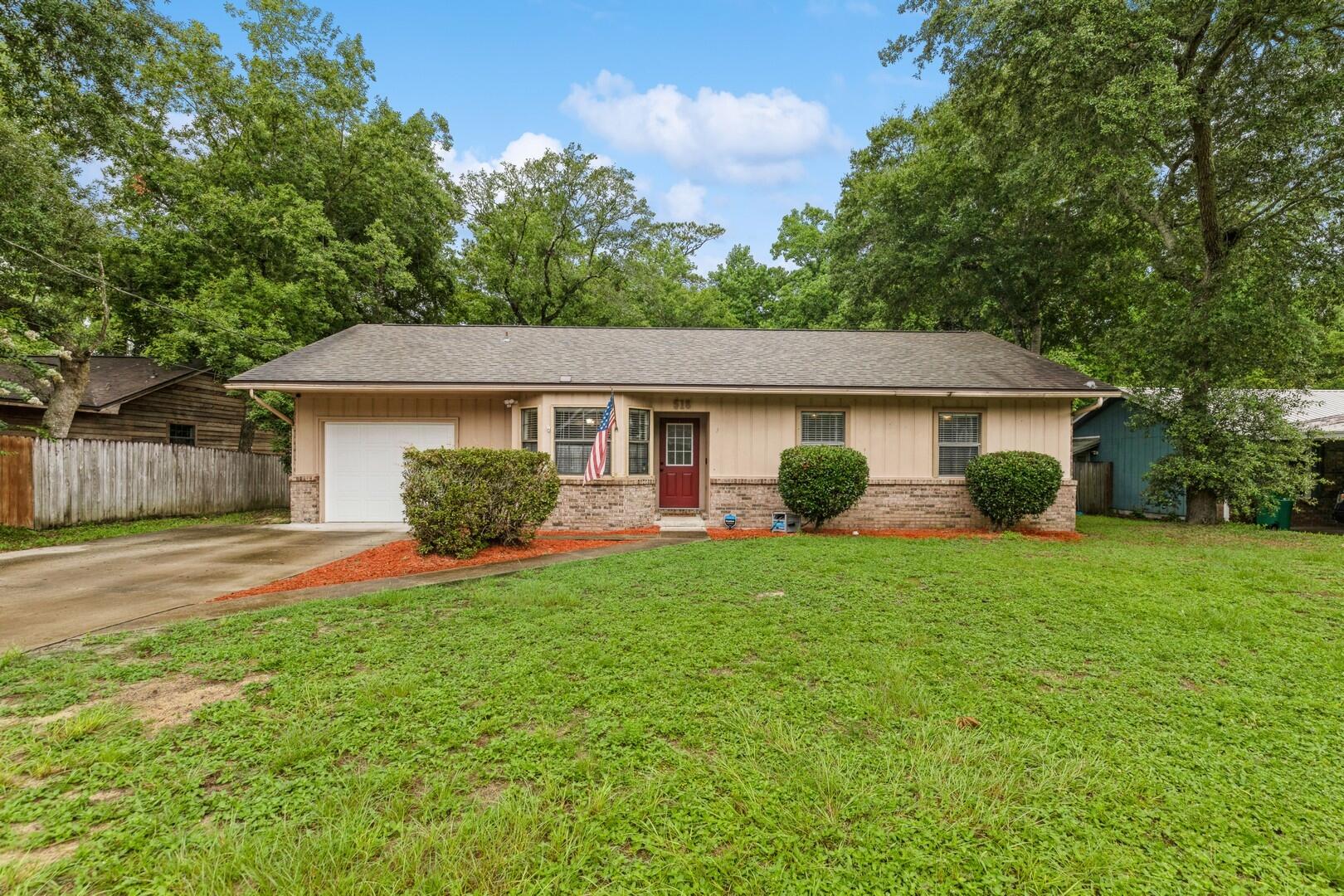 Welcome home! This Niceville charmer is convenient to grocery stores, shopping and schools! The kitchen has quartz counters, shaker-style cabinets, a tile backsplash and stainless appliances. In the living room, there's a cozy wood burning fireplace and ceiling fan. The master bedroom has a ceiling fan and the ensuite is a full bathroom with tile flooring. Two additional rooms are sizable and have ceiling fans as well. The second bathroom in the hallway has a tub/shower and tile floors. Head outside to the awesome multi-level deck that's great for entertaining & the fenced backyard has room for activities! Zoned for Plew Elementary, Ruckel Middle School & Niceville High School. Schedule your showing today!