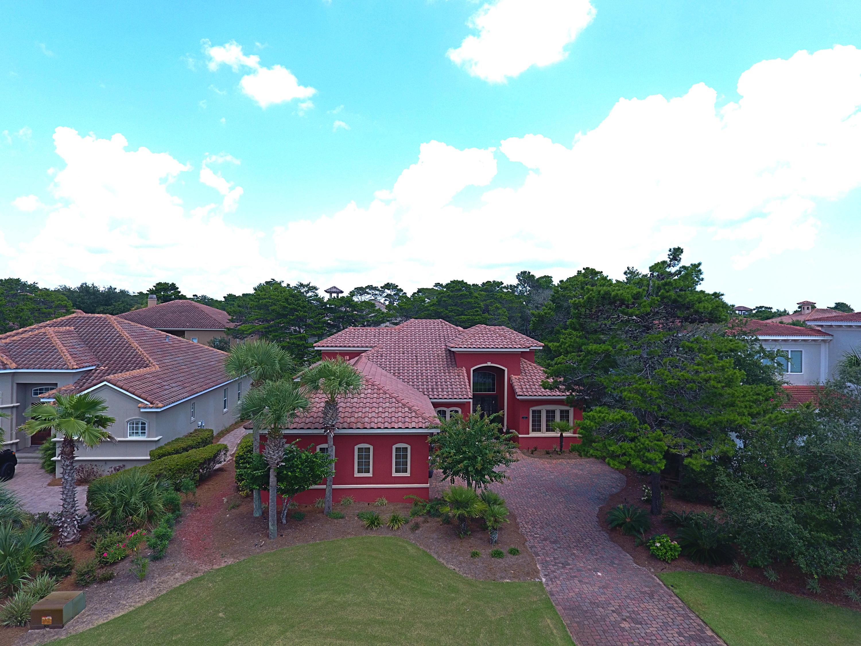 This stunning one-story Mediterranean-style home is located in the exclusive, gated, non-rental community of BellaMar at Gulf Place. This home features an open floor plan with gorgeous travertine tile throughout and incredible 16 ft. ceilings and the large bedrooms are accented with 10 ft. ceilings. This luxury chef's kitchen has stainless appliances, custom cypress wood cabinets and granite counter tops with a breakfast bar. The living room features cypress custom wood built-ins, a coffered ceiling and large sliding glass doors that leading out to the screened in 1,250 sq. f.t lanai with hot tub/spa and summer kitchen. The Large master bedroom has a trey ceiling and glass sliders that lead out to the lanai as well. The master bath includes double vanities, a travertine tiled shower with glass doors, and garden tub with jets. Large custom-built master bedroom closet. The heating & cooling system, water heater & summer kitchen grill all use natural gas. BellaMar at Gulf place has Low HOA Fees and includes a deeded and gated private beach access. BellaMar is located next to the Santa Rosa Beach and Golf Club and biking distance to dining, shopping and local family activities. Buyer to verify all dimensions. This is a short sale contingent on lender approval.