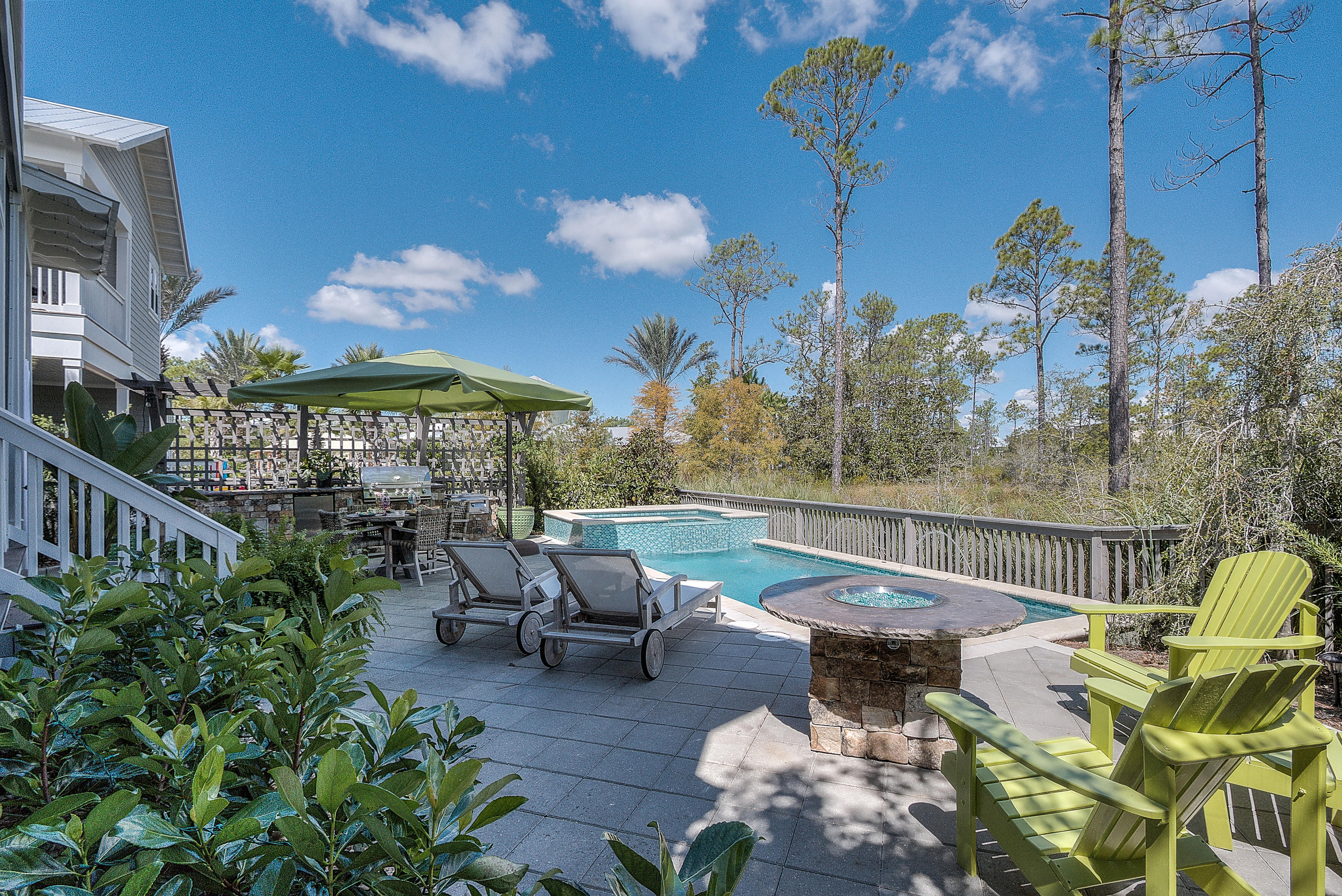 Premium listings like this do not come on the market often in NatureWalk at Seagrove.The only home under $1 million on 30A with heated saltwater pool & spa and outdoor kitchen, living! This better than new home has many upgrades and owners have thought of every detail. Never rented and in pristine condition. Open, spacious first floor living, kitchen, dining is set up for maximum potential for entertaining and flows out onto the screened in back porch and backyard oasis. This backyard is truly a peaceful paradise- backing to the protected preserve. Outdoor kitchen with cooler box, sink, 36'' Bull grill, fridge and big burner for shrimp boils. Gorgeous heated salt water pool & hot tub with fountain, jets, and led lights to set the mood for the evening. Also firepit for those chilly night Dog run fence and K9 antimicrobial grass has been added on the side of the house- perfect for your furry friend! 
Popular floor plan with guest suite downstairs, 3 additional bedrooms up (including master suite) and loft area for cozy family movie nights or potential for a bunk room. Grand master suite with double doors and covered porch overlooking the preserve. Spacious master bath with separated double sinks and soaking tub.  Closet has been upgraded with built in closet system. 
What could possibly make this home even better? The LOCATION- it's in a complete part of the community and 2 doors down from the Gathering Place and Lily Lane beach trail.  Beach trail makes the sugar white beaches of 30A just under a mile- 5 min bike ride! This naturally beautiful community features resort-style amenities for the entire family to enjoy. ''The Gathering Place,'' NatureWalk's amenity center includes: a resort-style beach entry pool, lap pool, children pool, play area, and a larger summer kitchen equipt with a television for game day. Also included in HOA dues is a summer shuttle to and from the beach! CDD paid off on this home- resulting in lower tax bill!