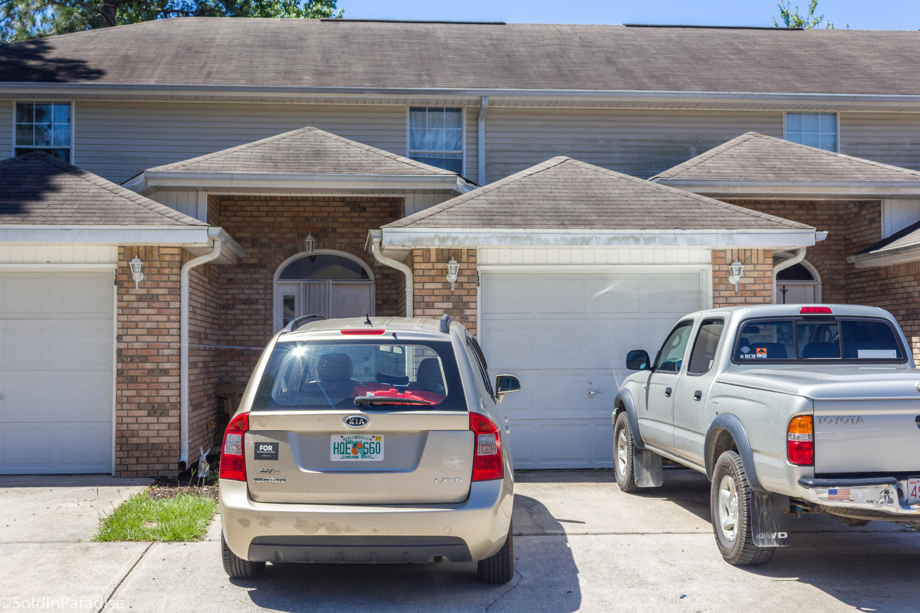 This lovely 2 story townhome is located in a quiet neighborhood in Mary Esther. The living, kitchen, and dining areas are open and flowing. The main living space was updated with ceramic tile flooring. Glass sliders lead you to the private fenced in deck and yard. Each of the two bedrooms feature their own bathroom and ample closet space. The laundry and half bath are located off the entry hallway. A one car garage provides additional storage or parking. Just minutes from beaches, shopping, schools, and only 6 miles from Hurlburt Field makes this a prime location. This unit has been well-maintained by the owner and is currently a rental unit. Buyer to verify all dimensions.