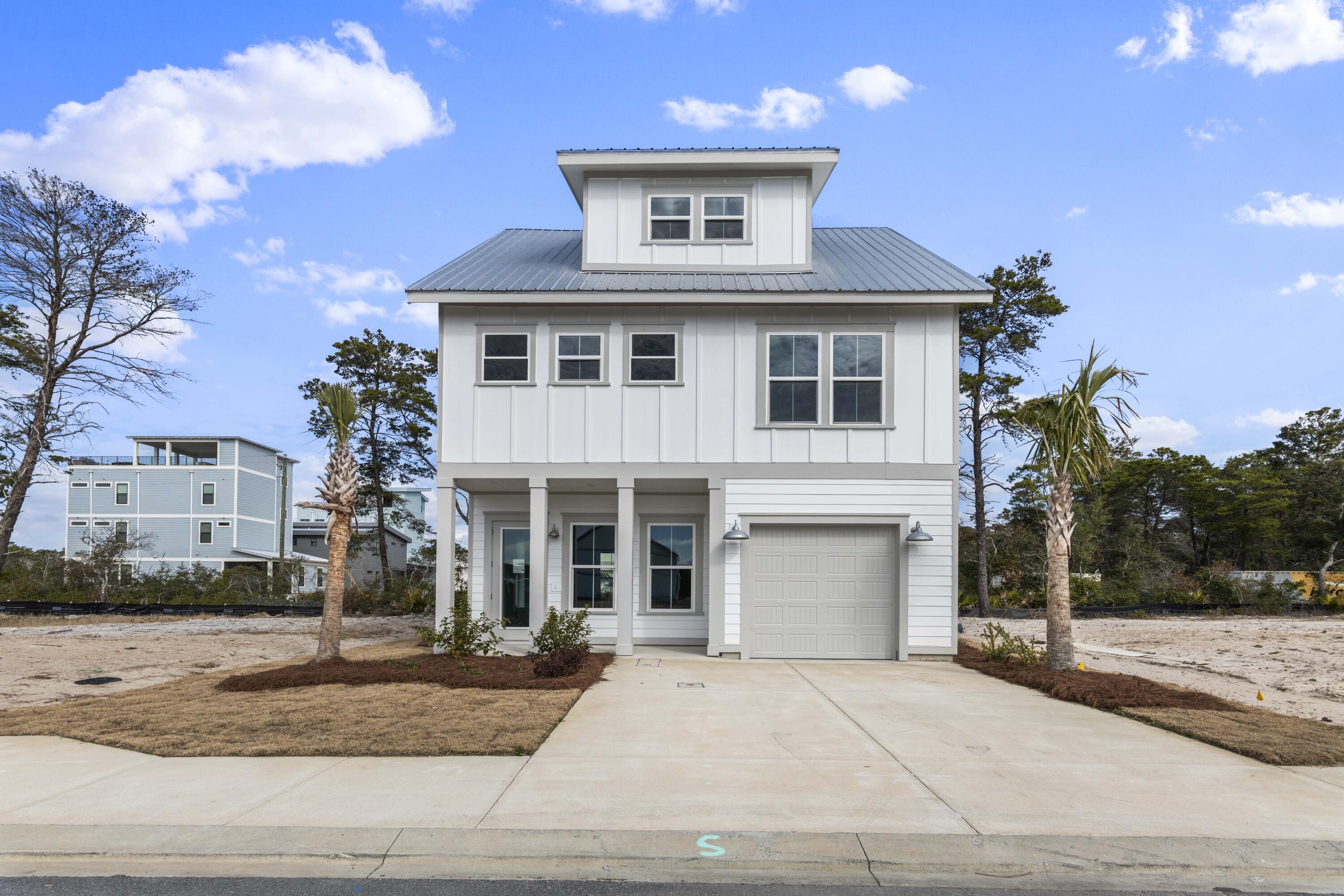 $10K FLEX CASH & MOVE IN READY!! Check out the new heated community pool at Nautilus Pointe nestled within the relaxed coastal setting of Inlet Beach. With just 32 homesites and 5 versatile floor plans to choose from, this exclusive neighborhood offers an ideal blend of privacy, quality craftsmanship, and proximity to the very best of Scenic 30A. The Marino floor plan features 4 bed, 3.5 bath, thoughtfully designed with an open-concept living layout & optional sunroom on the main level that seamlessly connects the kitchen, dining, and living areas, ideal for both everyday living & entertaining. Residents enjoy access to an incredible heated community pool, creating the perfect setting for year-round relaxation. Located just 0.5mi from the largest public beach access in Walton County Nautilus Pointe places sugar-white sands and emerald waters within easy reach. Adjacent to Rosemary Beach and 30Avenue, homeowners benefit from seamless access to boutique shopping, renowned dining, entertainment, and vibrant coastal experiences, while still enjoying the tranquility of a private residential enclave.

Each home is thoughtfully appointed with impressive standard features, including a durable metal roof, impact-rated windows and doors, quartz countertops, luxury vinyl plank flooring throughout common areas and bedrooms, 8 ft interior doors, and a gas range with vented hood in the kitchen. Buyers may select from 5 professionally curated design packages, all included as standard, allowing for a personalized yet streamlined building experience. Discover the ease of new construction living in one of Inlet Beach's most promising new communities where quality, location, and coastal lifestyle align beautifully.

*Please note: Prices may vary based on lot premiums. This listing reflects the base home price and does not include lot premium.*