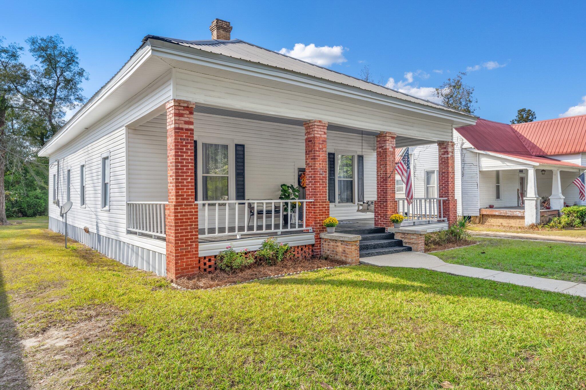 This charming historical home has been beautifully updated and is move-in ready! Enjoy a glass of sweet tea in the swing on the expansive front porch. Updates include a full bathroom, bedroom, a completely new kitchen + new appliances, new blinds, new flooring, new paint, and new central air which was added just 4 years ago. A new covered porch adorns the side entrance. Located in the heart of Chipley, this home is convenient to shopping, schools, businesses, and the beach is about an hour drive. If measurements deemed important, please verify.