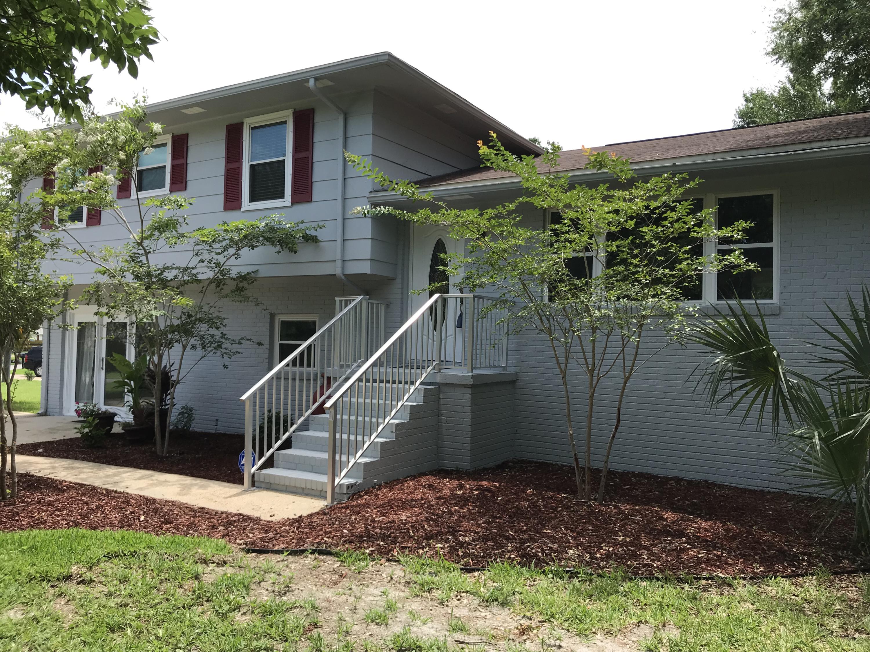 This charming three bedroom, three bath home with bonus room in easy walking distance to Destin Elementary School is perfect for a growing family. The home is located on a huge shaded corner lot with a big yard full of mature trees. This updated split level home features a main level that has a dining room / sunroom, a newly remodeled kitchen with granite countertops and newer appliances. Additionally, the main level has a large living room with a fire place and gorgeous hardwood floors. The top level consists of a large master bedroom with a freshly remodeled master bathroom. Two additional bedrooms and another newly remodeled bathroom are also on the top level. The bottom level features a bonus room with bathroom, a large laundry area, and a huge family area. The owner has recently replaced all the windows in the home with energy efficient ones and installed a new central air / heating unit ensuring years of comfort with a low electric bill. The large driveway provides plenty of parking for guests and a separate concrete pad is ideal for a boat or RV. The detached workshop / garage will be a favorite spot to work on projects and keep your tools out of the weather. A shaded back patio offers a retreat from the sun and a great place to entertain guests with cookouts plus a new privacy fence was recently added. Most importantly this home is in Destin, home of some of the best beaches, restaurants, shopping, and fishing on the Emerald Coast
