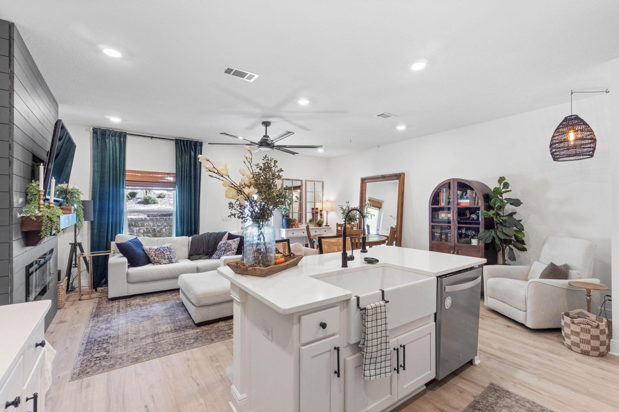 Experience coastal living at its finest in this exceptional 3-bedroom townhome. While many nearby towns boast about proximity to Destin beaches, locals know the real secret: being right in West Destin puts you in the heart of everything that makes this area so special. Under a mile from coffee shops, dining, playgrounds, HarborWalk Village, and local breweries...you're minutes from a handcrafted latte, sunsets by the harbor, or good times with friends.

The main level of the home serves as your entertainment hub, with an open layout, well-appointed kitchen, half bath, and seamless access to a covered back porch. Upstairs, your peaceful retreat awaits. All bedrooms are thoughtfully separated from the main living spaces. The primary bedroom features a spa-inspired ensuite with gorgeous tiled walk-in shower, double vanities, and generous closet space. Two additional bedrooms and a third full bathroom complete the second floor. Durable luxury vinyl plank flooring throughout means no carpet maintenance. 

The sellers have enhanced this 2023-built home with thoughtful upgrades, including:
- A custom fireplace feature wall with shiplap paneling, hearth, electric fireplace, and universal TV mount
- Updated half bath with new molding and paint
- New lighted ceiling fans throughout
- Upgraded kitchen sink and faucet with built-in bottle and glass cleaner
- DEAKO light switch dimmers
- Enhanced front yard landscaping with gutter downspout piping, gravel, and mulch

Unlike most units in Harbor Place, 32 Redbird offers a double driveway, plus ample guest parking.

Located in Flood Zone X, no flood insurance is required by the lender.

This is simply the finest home available in Destin in the $400,000 range; newer construction, premium finishes, unbeatable location, and practical features. 

Don't just visit Destin. Live here!