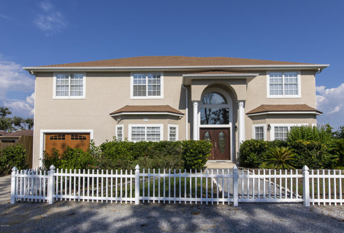 ACTIVE-CONTINGENT, SELLER ACCEPTING BACK UP OFFERS.
Waterfront home with gulf access. 829 N. Bay Drive is a premier residence located near the mouth of the bay in College Point, Lynn Haven. Enjoy sunrises and sunsets on your back porch and an evening jaunt across the Bay on your boat which is easily accessible from your own private dock on the 12,000 pound boat lift which can easily accommodate a 40 foot boat. This 5 Bedroom / 4 Bathroom home is strategically located on the mouth of the Bay and provides a short boat ride to Shell Island and the Gulf of Mexico for fishing expeditions. The layout of the home is seamless, and optimal flow and functionality were considered by the builder in every square foot of this executive residence.
As you walk through the front door of this home into to the foyer, a staircase ascending to the top floor and custom chandelier greet you.
Walking into this home, an ambiance of comfort surrounds you, and entertainment is paramount with the kitchen, formal dining room, living room, master bedroom, one guest bedroom, and half bath all located on the first floor.
The owner spared no expense when they put in an inconspicuously located elevator for ease and convenience when moving to the upstairs.
Once you take the elevator, or staircase to the second floor, you will find another master bedroom, two additional guest bedrooms, a bathroom, den with kitchenette, large bonus room, smaller bonus room, and laundry room. This executive home is equipped with stainless steel appliances, and new shower doors. The large garage is air conditioned and can be used as a workshop.
There is a large deck off the back of the home and two second floor balconies, all overlooking the Bay, and your boat dock. Additional features include a surround sound system, fireplace, numerous walk-in closets, drive-through garage, an aerobic performance septic system, private well, and ample parking with gravel area in front, and concrete 4+ car driveway and garage.
Other upgrades include a walk in pantry, fireplace, built in solid wood cabinetry, Quartz counter tops, breakfast bar, additional laundry hookups in downstairs master, jetted tubs in both masters, with additional walk in showers, Culligan water softener, security system, upgraded LED lighting, and large walk in closets.
College Point is a quiet, family-friendly neighborhood just around the corner from a park and boat ramp and minutes from schools, shopping, medical facilities and more.
Don't wait another moment! Come see this home and find out why waterfront homes of this magnitude are rare and sell quickly