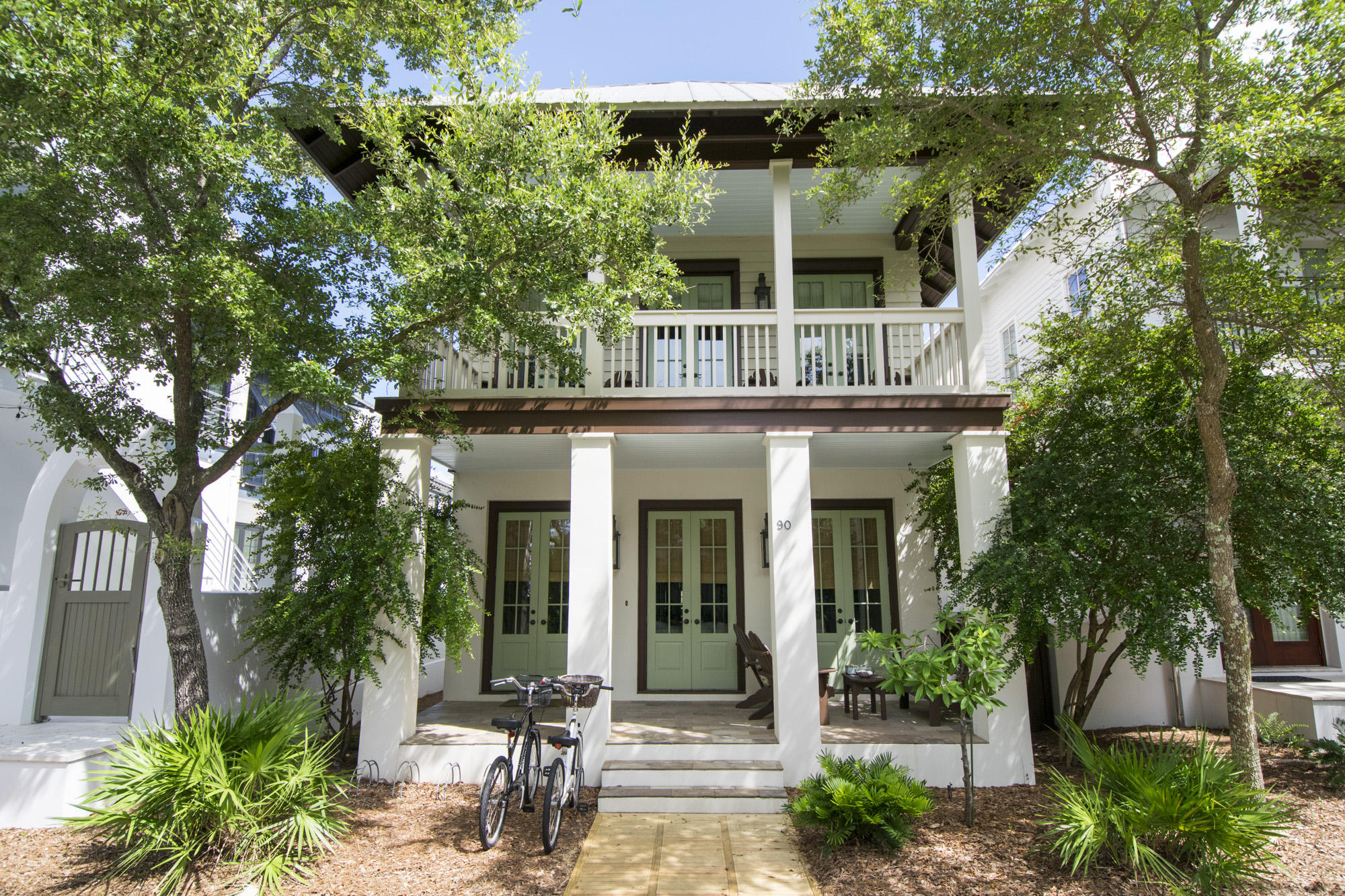 Light and bright, this 3 bedroom PLUS bunkroom, 3 bath home welcomes you with designer finishes and large rooms perfect for beach living. Designed by architect Tom Christ, this NEVER RENTED home features..Hardwood floors throughout, 10 ft ceilings, spacious living area, an especially large master bedroom with vaulted ceiling, and an open concept kitchen with Carrara countertops. The master bath features dual vanities, marble countertops, garden tub, large closet and linen closet. A pantry, large closets and storage and full laundry room make for comfortable, easy living. House is in great condition (Fresh exterior trim paint November 2015) and is being sold furnished. The lot is approved for the addition of a 1 car garage with carriage house. This wonderfully situated home is steps fro the fitness center, sky pool, Rosemary Beach Racquet Club, Owners' Pavilion and  Barrett Square. Enjoy a short, shaded stroll to the beach!
