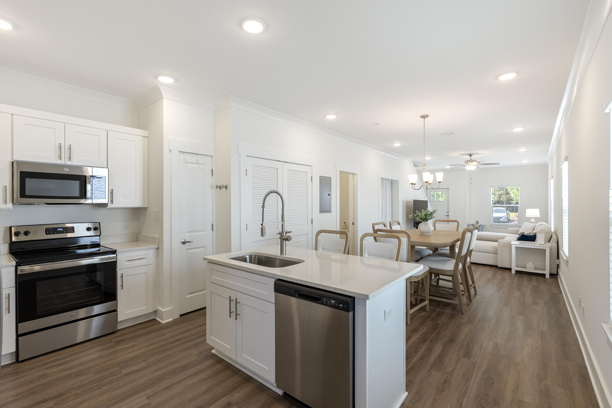 Welcome to your new coastal retreat located in the beautiful community of Verandas at Freeport! This beautifully maintained 3-bedroom, 2.5-bath townhome, offering a truly turnkey opportunity for full-time living or investment property. Step inside to a spacious open floorplan, perfect for entertaining or relaxing. The modern kitchen boasts quartz countertops, stainless steel appliances, and a generous island overlooking the bright
and airy living and dining areas. Enjoy easy maintenance and upscale style with luxury vinyl plank flooring throughout the main living spaces. Upstairs, you'll find a large primary suite with a private en-suite bath, along with two additional bedrooms and a second full bath. A convenient half-bath is located on the main level. Furniture is negotiable!