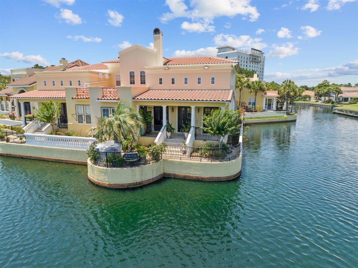 Nestled in the back of the peaceful views at the Fountains at Sandestin, this 3 bedroom, 3 bath features impressive, modern updates. Buyers will love this beautifully decorated villa, which comes partially furnished.  Open the French doors of the  living room and enjoy the quiet, relaxing views of the lake and fountains and Baytowne Golf Course.  The gorgeous master bedroom is downstairs with a large walk in closet.  The two spacious upstairs bedrooms both have their own bathrooms.  The upstairs also includes a sitting room/office.  You are just steps away from the Baytowne Wharf Village.  Enjoy resort life via golf cart for dining, beach, golf courses, tennis, spa, marina, & pools on the 2000 acre resort. For additional living space, the garage is heated and cooled.