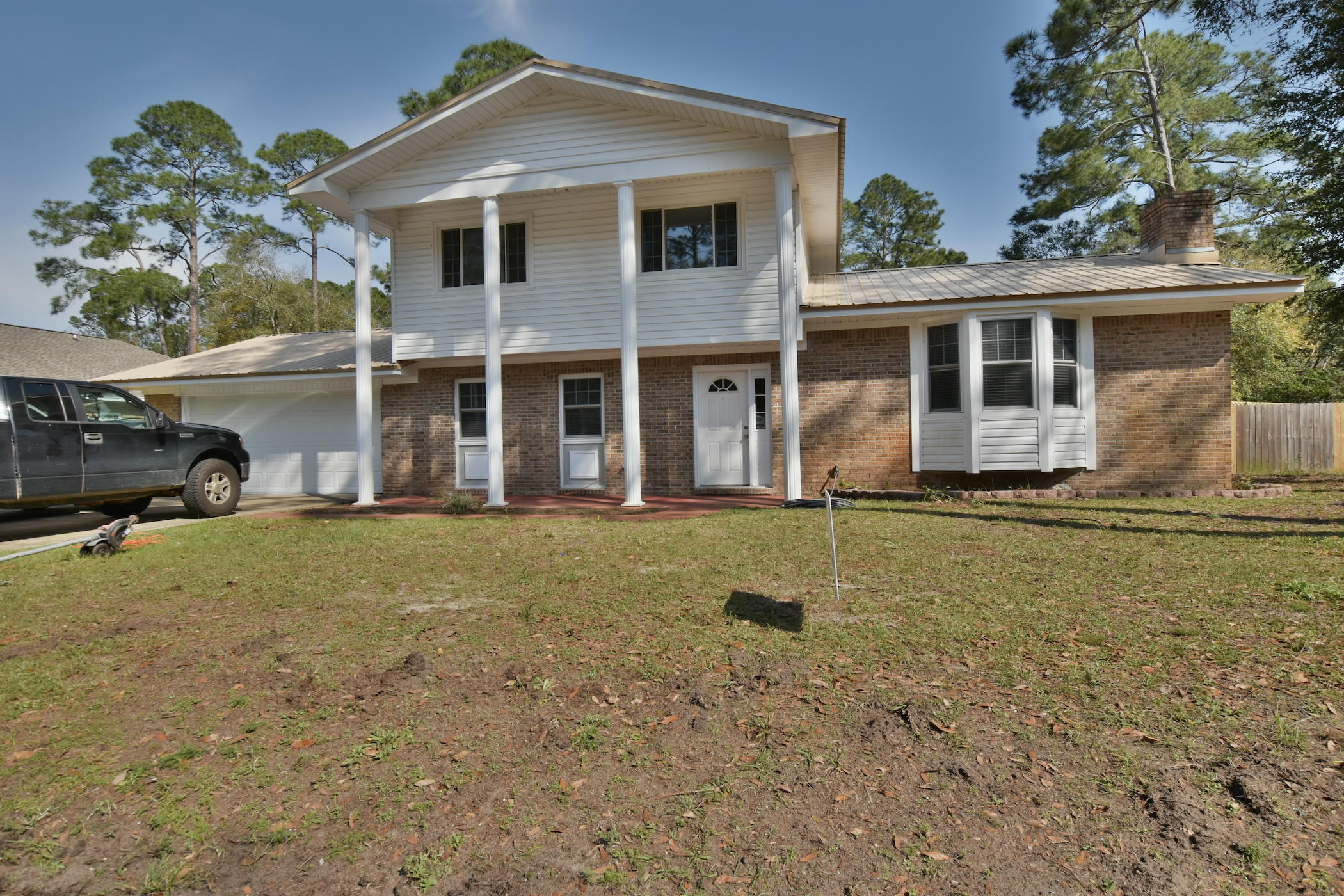 Great home in the heart of Niceville. A block away from the water and estate sized homes. This 4 Bedroom 2.5 Bath home has been recently updated and looks brand new! 2 Living areas, Large Kitchen with new appliances. Tile floors everywhere, carpet in bedrooms. Large Laundry room, privacy fenced backyard with lots of room. Low maintenance brick and vinyl siding and a metal roof.