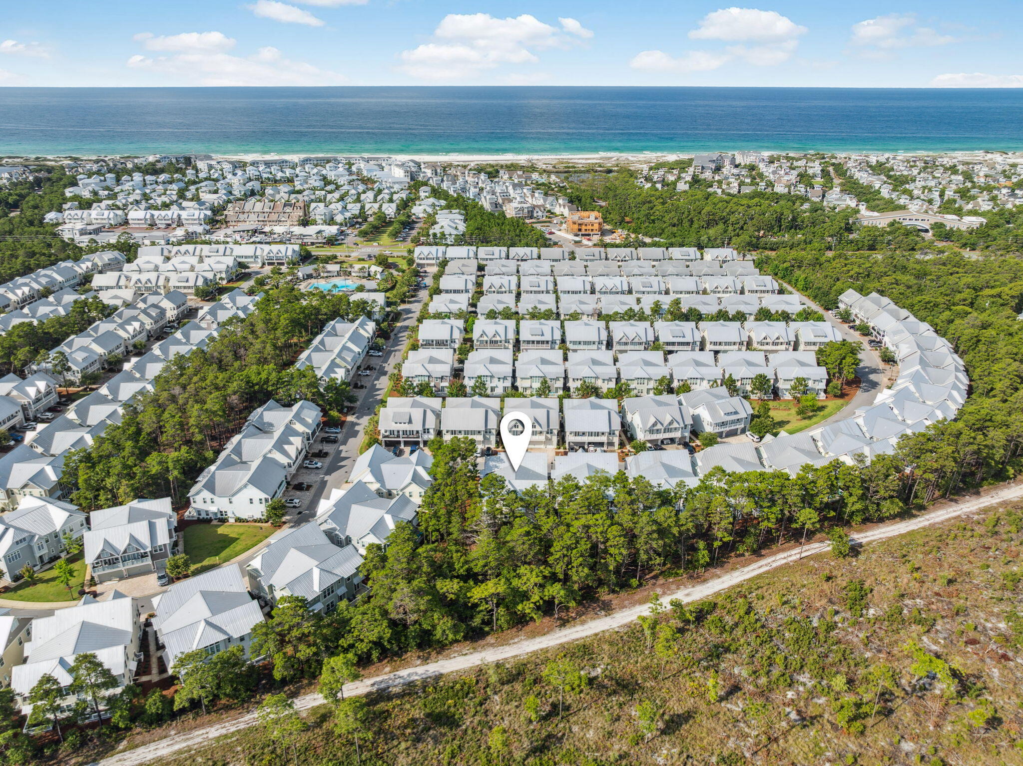 Experience refined coastal living in this luxurious townhome located in the scenic Prominence community, just a short distance from resort-style pools, shopping, dining, and the 30A bike path. The thoughtfully designed open-concept living and dining area on the first floor features soaring ceilings that enhance the spacious layout. Step from the living room onto a large porch overlooking the natural preserve of Deer Lake State Park.

The kitchen is well-appointed with a large center island, farmhouse sink, custom cabinetry, Quartz countertops, stainless steel Electrolux appliances, and a striking tile backsplash—designed with both function and style in mind. Upstairs, the primary suite includes an ensuite bathroom, and two additional bedrooms share a full bath. A calming, neutral color palette throughout offers a clean canvas for personalization. The two-car garage and additional driveway spaces provide ample parking and storage.

Located on the east end of 30A, Prominence is a vibrant neighborhood featuring two resort-style pools, a fitness center, a private beach shuttle, and the Big Chill town centerhome to restaurants, shops, live entertainment, and a covered pavilion with a state-of-the-art cinema screen.