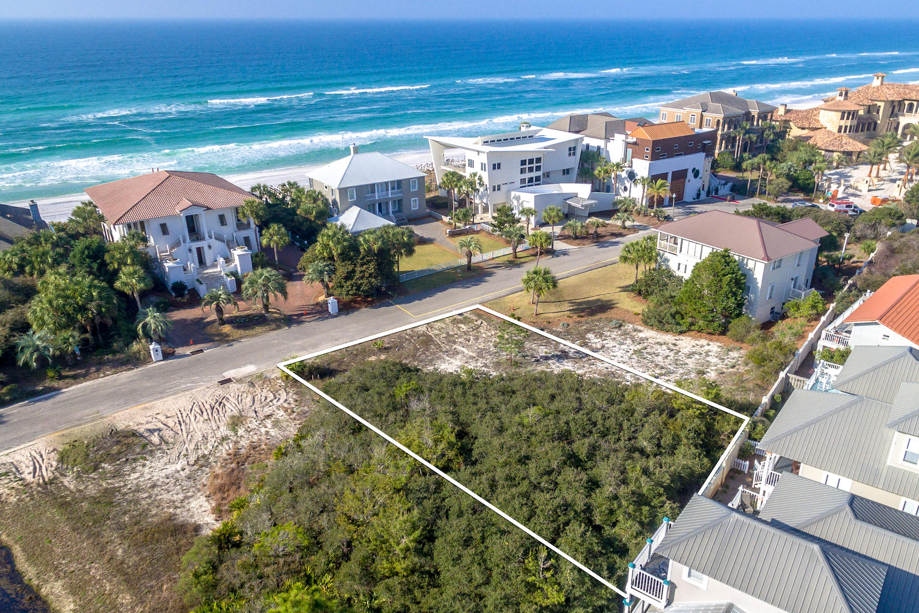 Wonderful opportunity to build your dream home in this exclusive and gated Gulf Dunes neighborhood in Santa Rosa Beach. Just one lot from the beach, and surrounded by prestigious homes, where tranquil living in a relaxed community abounds. This large home site, just under 1/4 acre and priced to sell, offers views of the emerald waters of the Gulf of Mexico. The intimate Gulf Dunes neighborhood of only 17 homes sites, enjoys proximity to the nature trails of Point Washington State Forest and the 25-mile bike path along Scenic 30A. Located near Gulf Place, Blue Mountain Beach, and Seaside, this rental restricted enclave promises a serene lifestyle. Imagine living the Florida life, in a home of your design, with easy strolls on the beach, and biking or walking to shops and restaurants.