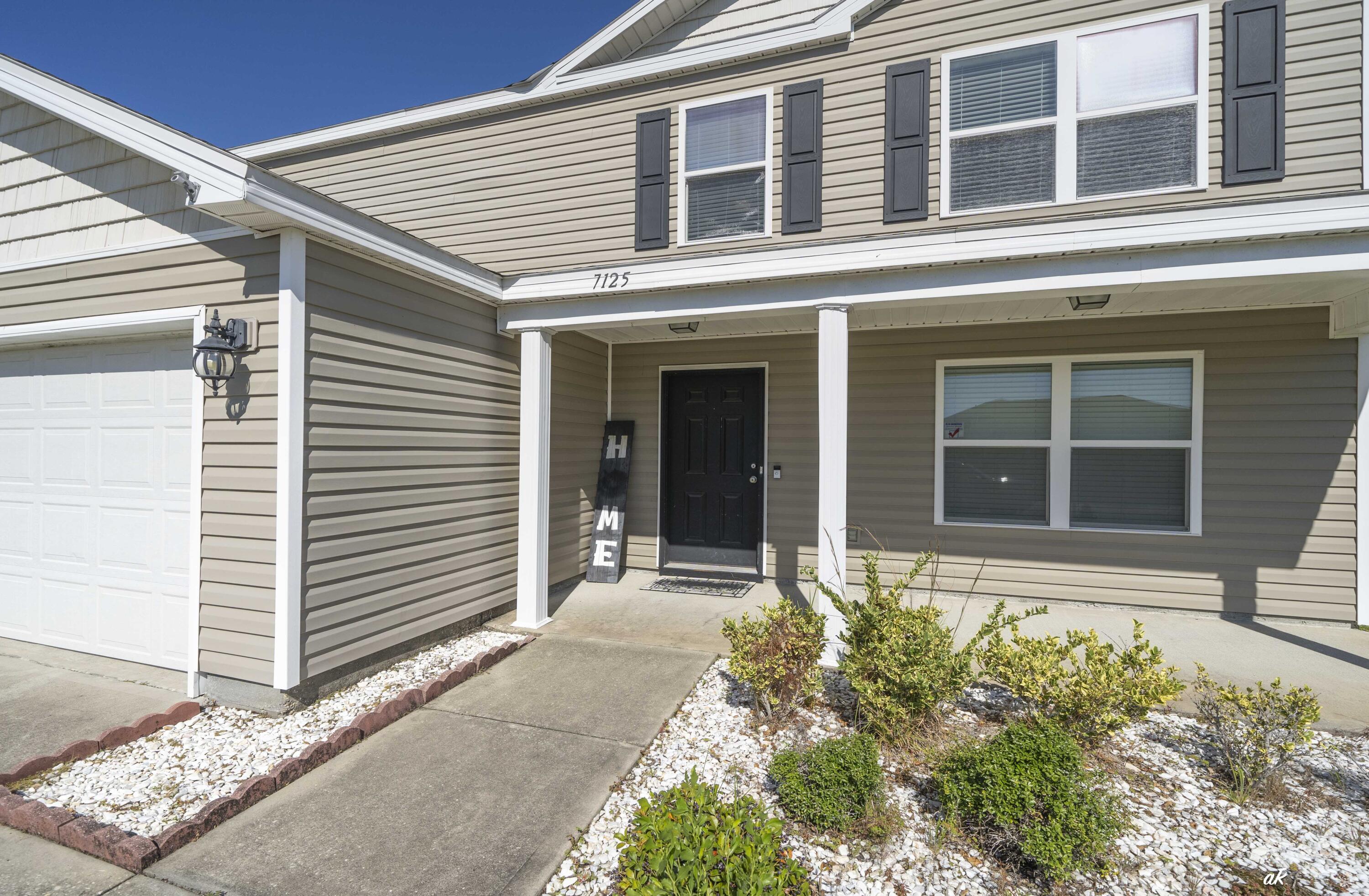 Spacious 5-Bedroom Home with Pond View in Barrett's Park - 2,744 Sq Ft!

This house has the largest floor plan in Barrett's Park, offering 2,744 square feet of thoughtfully designed living space. Ideally located just 10 miles north of the former Panama City Mall and a 17-mile drive to Tyndall AFB, this spacious home combines comfort, functionality, and convenience.

Step inside to an inviting open-concept layout that begins with a flexible front room, perfect as a study, formal dining room, or home office. The kitchen is a true centerpiece, featuring a large pantry, center island with breakfast bar, and clear sightlines to the living and dining areas, ideal for both entertaining and everyday living. The first-floor primary suite provides a peaceful retreat, complete with dual vanities, a separate shower and soaking tub, a private water closet, and a spacious walk-in closet.