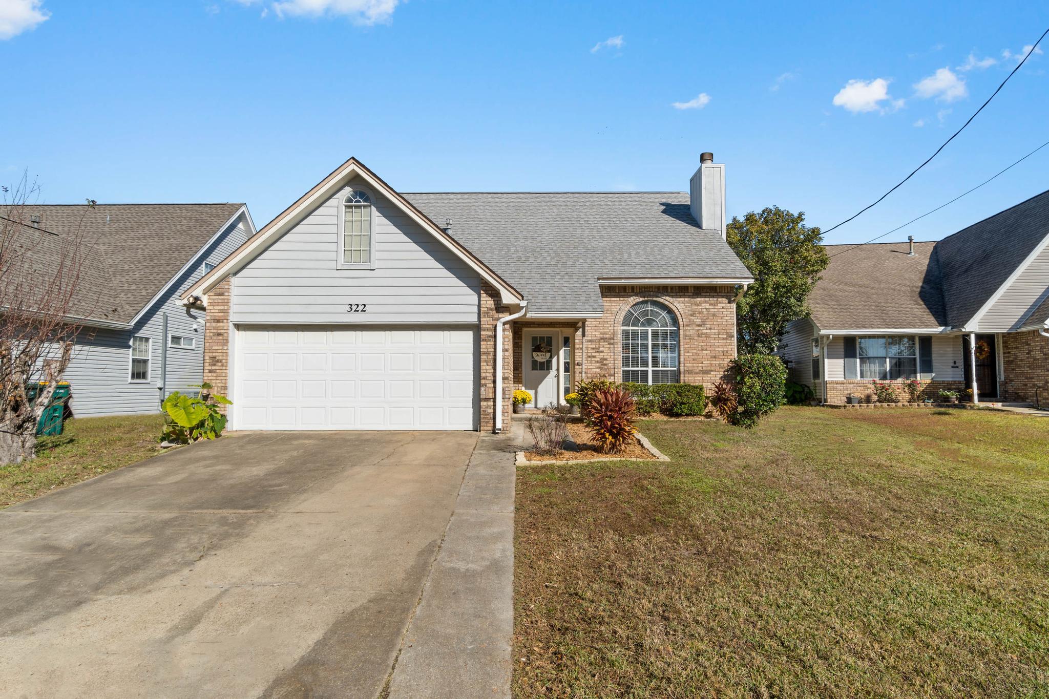 Welcome to this lovely west Mary Esther home only 7 minutes from Hurlburt Field's front gate! Enjoy 3 bedrooms, 2.5 bathrooms with a formal dining room and a specious upstairs loft in a neighborhood with no HOA fees, no flood insurance is required for this home! You'll also have peace of mind with a roof replaced in 2016 and a new HVAC in 2015! Pull into the driveway and appreciate the tasteful landscaping and the expanding parking slab for more space. Walk inside and you'll love the soaring cathedral ceilings and the entire interior freshly painted walls. You will love the spacious living room complete with a fireplace and large windows for plenty of natural light! There is a dining room that's a great extra space, in fact it's currently being used as a play space. The kitchen has an additional eat in kitchen space, plenty of cabinets, and a pantry with custom shelves. Also downstairs is a half bathroom, and interior laundry room, and the massive master bedroom! The owner's suite features a bathroom with a double vanity with framed mirror, and a huge walk in closet you'll have to see for yourself! Walk upstairs and you'll find a fantastic loft perfect for a multi-use space (currently a home office) along with two more nice sized bedrooms with ample closet space and a shared full bathroom. Back downstairs exit out the back sliding glass door into a screened in covered patio where you'll enjoy Florida evenings. Inside the fully fenced in backyard there's also a great patio perfect for entertaining, relaxing, and grilling! Don't delay in making this home your own and check out the list of seller updates!