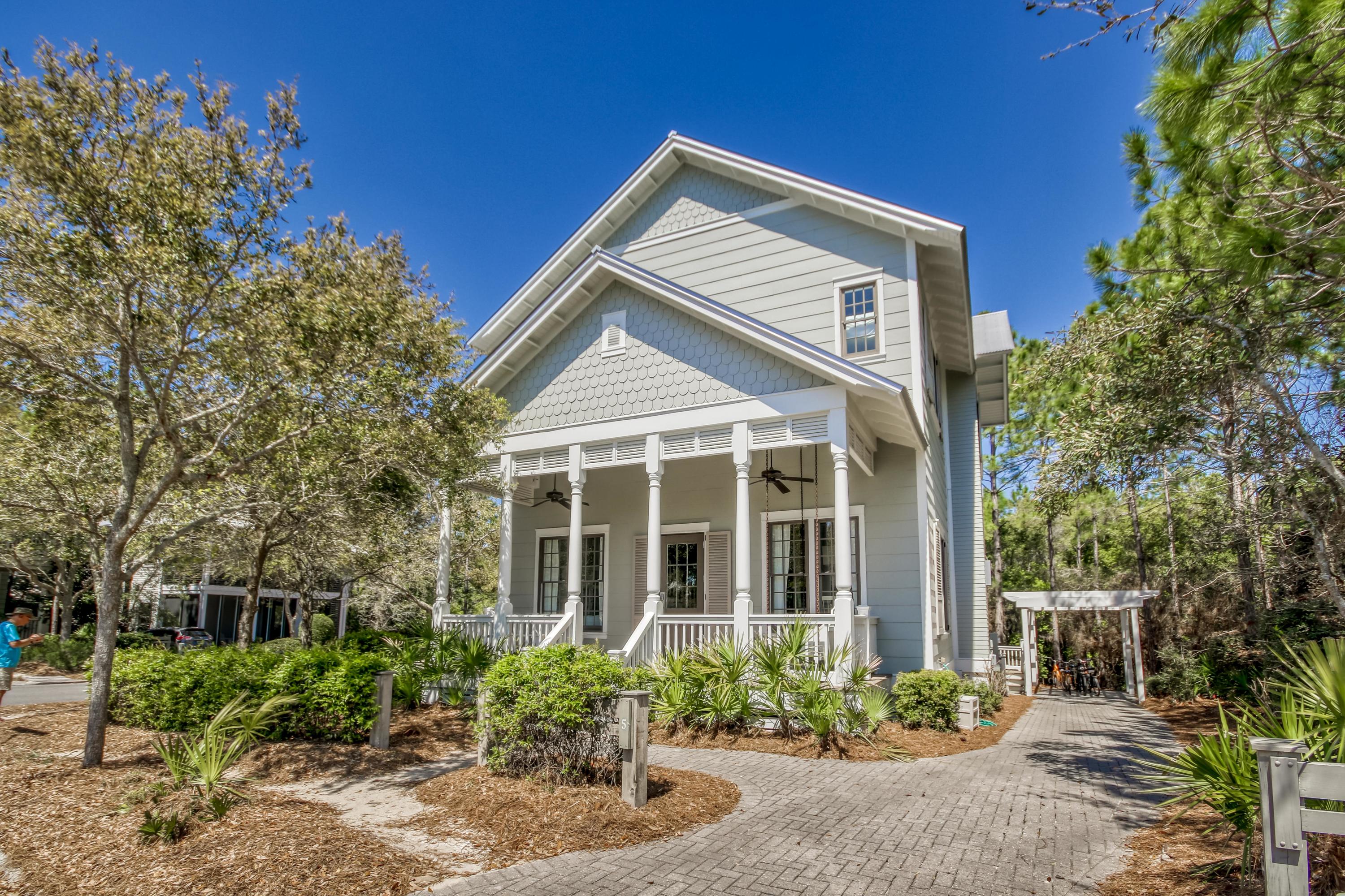 Great Value in WC! 5 Pond Cypress is the perfect location to enjoy all Watercolor has to offer. It sits on a corner lot 2 blocks from the Frog Pool and 2 blocks from the Camp Watercolor Pool and Playground. The Bridge to the Town Center is an easy walk or bike ride. Watercolor Crossings Publix is also close by making a trip to the grocery store simple instead of a chore. Combine the location with the open floor plan, tall ceilings and large rooms, and you have a wonderful place to be your cottage at the Beach. The Large Master Bedroom and Bath is located on the main floor. There are 3 large bedrooms with their own baths on the 2nd floor plus an additional living space with 2 built in bunks for kids and family to gather.
Wide outdoor porches, wooded lot,and privacy. Come take a look!