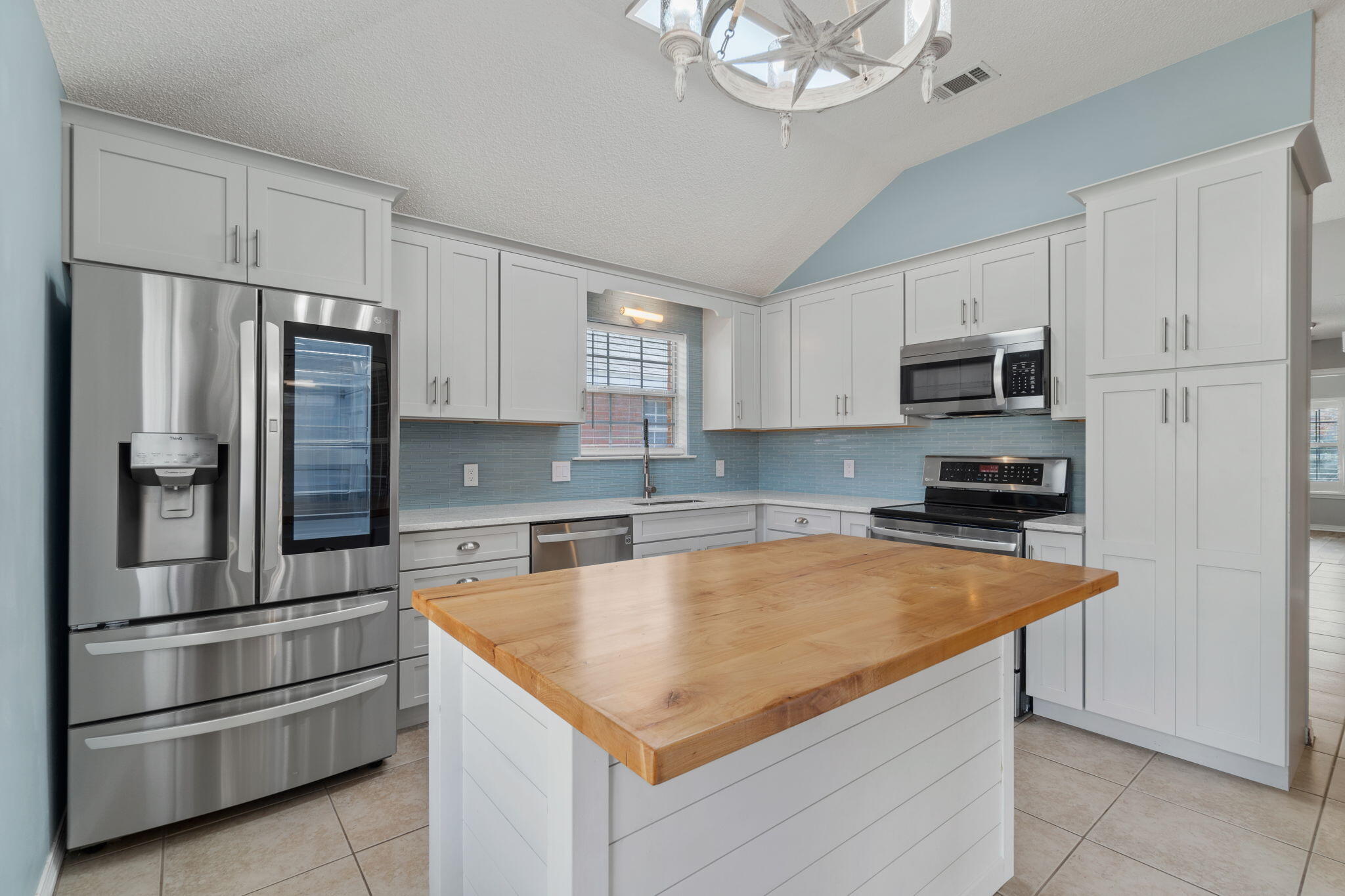 *Pet Friendly, updated, and available now* Welcome to the adorable and perfectly located neighborhood of Bayside! Positioned walking distance and tucked behind 98 beside the Silver Sands Outlet mall you will love being in the heart of Miramar Beach close to shopping, dining, and gorgeous beaches. Additionally, enjoy neighborhood amenities such as a pool, pavilion and grilling area, playground, tennis/pickleball court, and bay access with a fishing dock right on the water! This thoroughly updated home features a split floor plan with 3 bedrooms, 2 baths, an enclosed heated and cooled Florida room, and a 2 car garage (with epoxied floor) within a fully fenced in backyard. NO bedroom carpet! Tile and luxury vinyl floors are throughout. Each closet has a custom closet organizer. Quartz counters in both bathrooms adorned with updated lighting and lovely shiplap above updated cabinetry. The kitchen is well appointed with stainless appliances including an updated french door refrigerator with custom features. You'll love the tasteful sea glass subway tiles accenting the gorgeous quartz counters, soft close custom cabinets, and the kitchen island was custom made for this space with room for bar stools, and pull outs to maximum storage in addition to the custom pantry and spice rack/pan storage on either side of the oven. The interior Florida room is a great space to relax with the lovely brick flooring. Love other upgrades like plantation shutters, ceiling fans throughout, recessed lighting, and custom fireplace with a wood mantle. The yard was renovated with all new landscaping and there is a sprinkler system (on a well so you're not paying for water!). Trash and pest control is included in the rent as well as all neighborhood amenities. Pets are allowed with a $300 non refundable pet fee per pet, 2 pets maximum, no aggressive breeds. Security deposit is equal to one month's rent but can be broken into two payments.