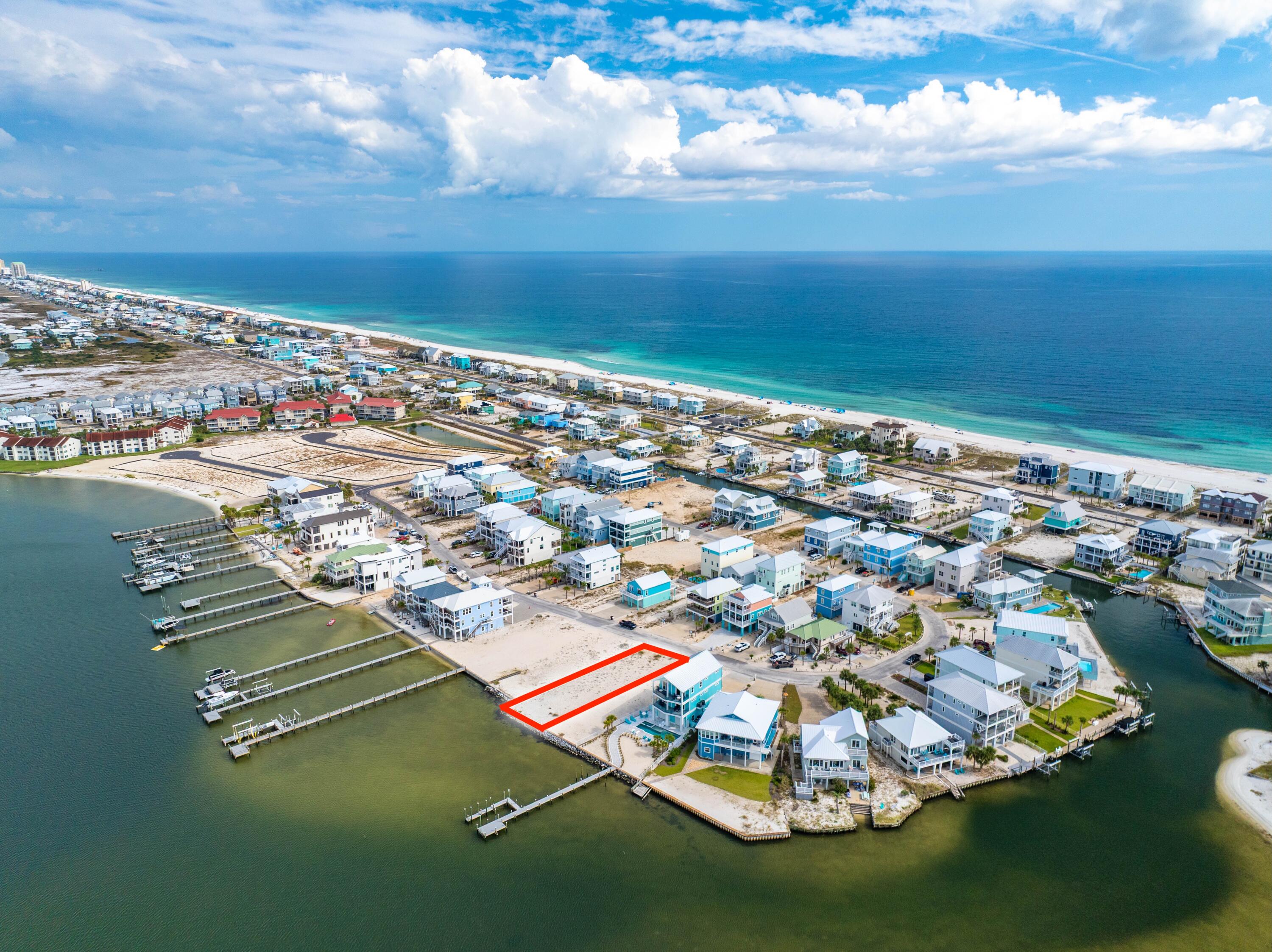 One of the few remaining Vacant Soundfront Lots on Navarre Beach, 7364 Grand Navarre Blvd offers you an exceptional opportunity to own 46' of pristine Santa Rosa Sound frontage on a Vacant, Cleared Lot that's ready for your dream waterfront home. With a seawall already in place, the lot is ready for you to bring your build to life. Enjoy breathtaking panoramic water views, tranquil coastal living, and exceptional sunsets. The lot offers the potential to add a dock complete with boat lifts and jet ski lifts for a true waterfront paradise. Whether you envision a private retreat or an elegant coastal estate, this property offers the perfect blank canvas with direct sound access and serene sunsets over the water.
Navarre Beach is one of the last areas with an 'Old Florida' appeal and a  Fantastic Place to Live and Own a Piece of Paradise as either Secondary/Investment or Primary Home. Navarre Beach has Miles and Miles of White Sandy Beaches and Stunning Emerald-Hued Waters. There's plenty of Leisure Activities to enjoy, whether on the Gulf or the Santa Rosa Sound, with Parks, Hiking/Biking Paths, and the Spectacular Gulf Islands National Seashore. Just over the National Seashore is Pensacola Beach for even more Entertainment, Shops, and Restaurants.