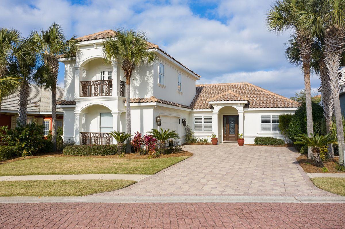 This is the quintessential beach villa located within the gated enclave of Destiny East. The main living areas are all optimally located on the first level with ample parking in the oversized two car garage as well as ideal privacy from the screened lanai with a private pool and adjoining spa built in 2016. This beautiful home offers double height vaulted ceilings and a wide open floor plan complete with a recently remodeled kitchen featuring quartz countertops, stainless appliances including a gas range and ice maker. The spacious living and dining areas are open to the kitchen and are anchored by a shell infused gas fireplace with ample built in storage. The master suite is located on the first level and offers a sprawling en-suite with an oversized walk in closet, dual vanities, soaking tub and a walk in shower. There are two additional bedrooms downstairs that share an en-suite bath as well as a massive second floor bedroom / additional living space that serves as a guest suite, complete with its own full bathroom and Juliet balcony. 

This home has been pristinely maintained as a strict second home but can also be easily transitioned into a top producing short term rental. Other notable features include a freshly painted exterior facade and new air & heating units. Destiny East is heavily amenitized with two gated access points as well as 24 hour security, community clubhouse with a fitness center, movie theatre, resort pool and spa, kids playground and tennis courts.