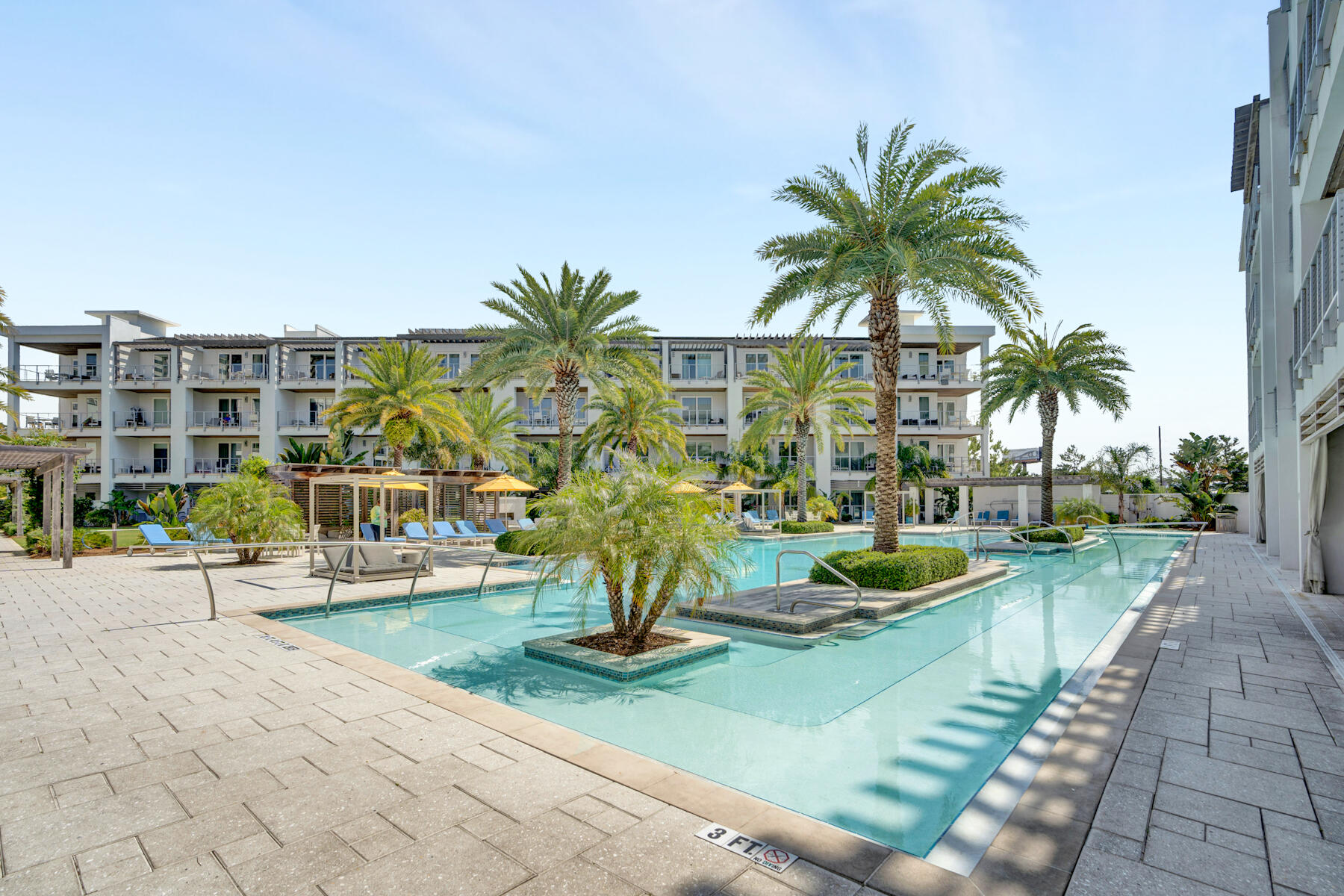 This fully furnished 3 bedroom 3 bathroom condo offers gorgeous views of the palm trees and cabanas around the Resort-style pool. Directly next to Rosemary Beach, at the intersection of Hwy 98 and Hwy 30A. The kitchen has an oversized island with a sink and bar seating around the recycled counter tops. Stainless steel appliances with gas cooktop. From the kitchen island, look into the living area with gas fireplace and mounted TV. A dining table seats six. Another private balcony is off of the living room. The master bedroom has a king size bed and opens up to a spacious private balcony. The master bath has double vanities a garden-style soaking tub and separate shower. The second guest bedroom is furnished with 2 queen size beds and a private balcony.  All information and dimensions to be verified by buyer****