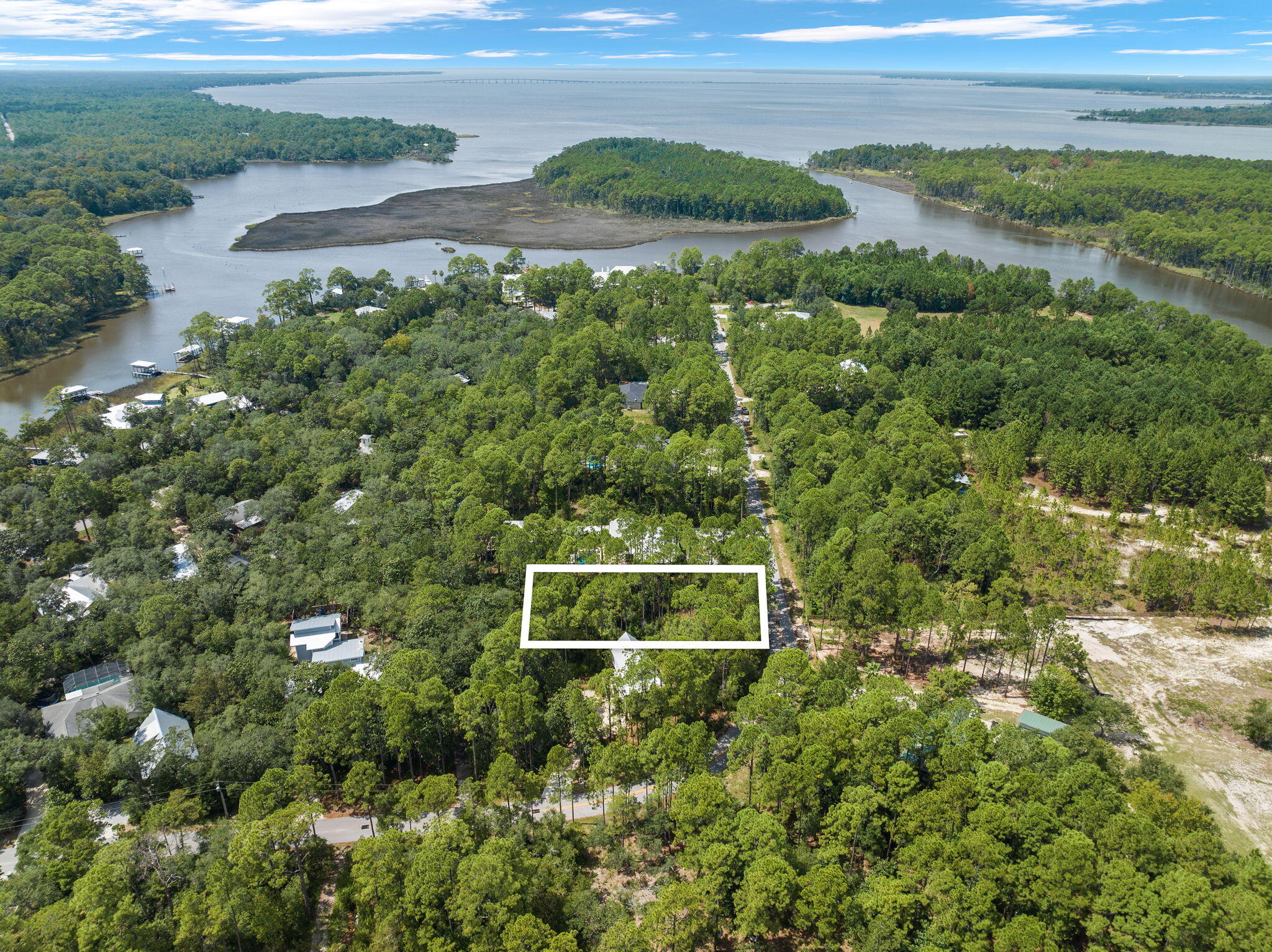 Spacious lot available in the sought-after Historic Point Washington area, just minutes from the boat ramp. This generous lot provides ample space to build your dream home. With no HOA fees and no build-out restrictions, this is a prime opportunity to create the perfect bay-side retreat. 

Approved building plans will convey with the sale creating a truly compelling and turn-key development opportunity. Inquire today for more information.