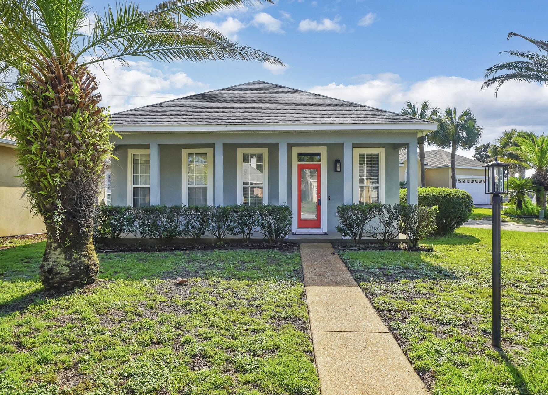 Do not miss an Opportuinity to own this quaint Two bedroom, Two full bath home with flex room (nursery, office or den) located off Master Bedroom. Flex room has doors leading to privacy fenced back yard and garage.  Luxury Vinyl Planking throughout and renovated baths bring a contemporary flair to this open floor plan that creates a seamless flow throughout.  Located on the south side of Highway 98, the white sandy beaches and emerald green water of the Gulf of Mexico are only minutes away.  Explore the vibrant dining scene, indulge in retail therapy, or immerse yourself in the many recreational activities. Embrace the natural beauty of the area and make cherished memories in this captivating home with covered front porch.