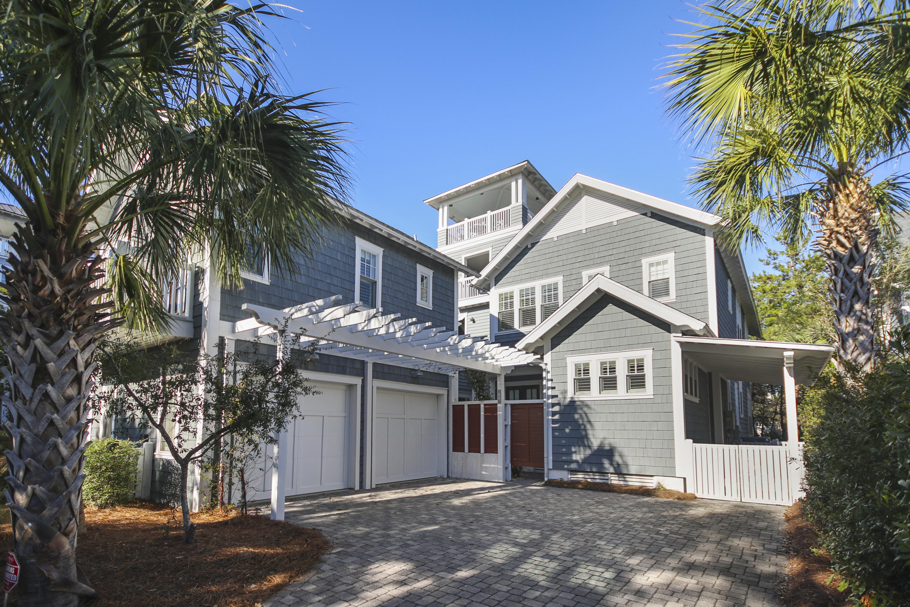 Enjoy the expansive, private beaches and coastal dune walkovers that only life at WaterSound Beach offers, in this spectacular custom home. From the moment you walk inside, you'll know your home. The residence exceeds all expectations and is characterized by intricate, detailed craftsmanship, including stained natural wood, crafted into extraordinary moldings; and unique ceiling accents in several rooms.
The home is introduced via an impressive concept living area that opens to the chef inspired gourmet kitchen with a remarkable oven hood over the 6-burner gas stove and suite of Thermador professional appliances. The oversized center island with a farmhouse sink includes a stunning natural countertop. The great room is further enhanced by the pecky cypress ceiling with reclaimed beam accents that sit atop heart of pine flooring throughout the home. Other highlights include first-floor master suite with an indulgent ensuite, and spacious laundry room. Additional bedrooms with private ensuite are on the second level with vaulted ceilings and additional beam accents. Outside, there is an expansive private patio space with a grilling area, including a two-car garage and a separate carriage house, connected via a second story bridge, allowing for the ultimate in privacy. Enjoy your own fully equipped apartment with full sized bedroom, well-appointed kitchen, separate breakfast nook, full bath and a living area! This home is being offered fully furnished and will be move-in ready!