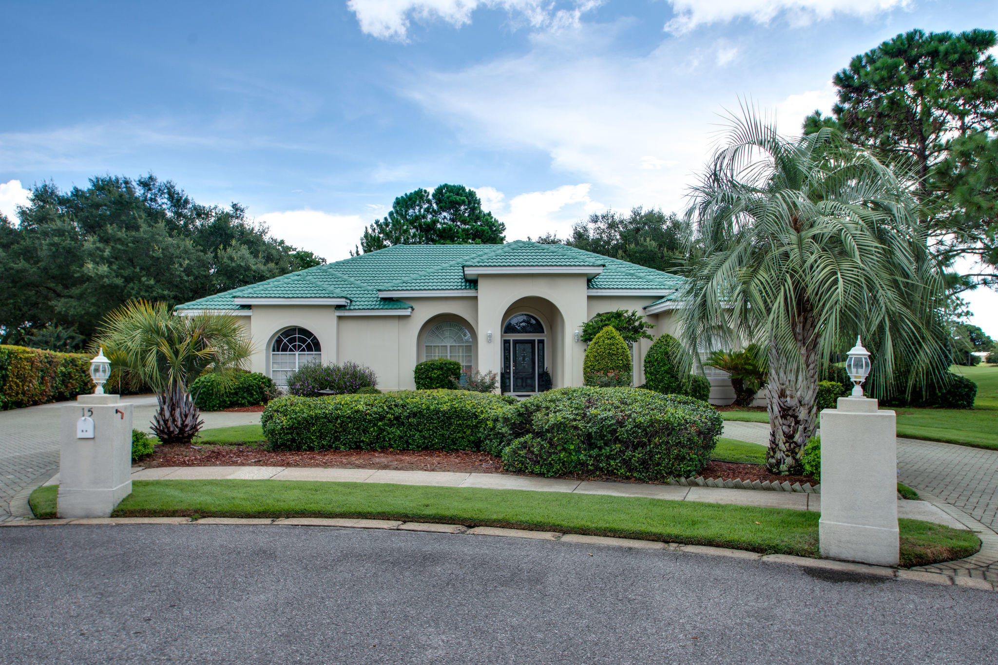 Stunning location and golf course views and the end of a private cul de sac. Located on the 5th tee and beautiful 4th hole with views down the course. Custom built, 4 bedroom 3.5 bath home with separate office, formal dining room and living room area in addition to open floor plan and great room. Enjoy the view from most rooms in the home, cement tile roof recently painted and sealed, custom gunite pool with screen enclosure and lush landscaping. Master en-suite has two walk-in closets and large master bath, with tub, double vanities and walk-in large glass enclosed shower. Kitchen has custom cabinets, corian kitchen counter tops, and brand new sub zero refrigerator. Large laundry room with sink and extra storage, wired for alarm system and speaker system inside and out. Paved dri way.  Termite bond in place, owners have taken meticulous care of this stunning home with stunning views in a secluded location.  One guest bedroom is like a second master, with it's own full bath and sliding door access to the pool.