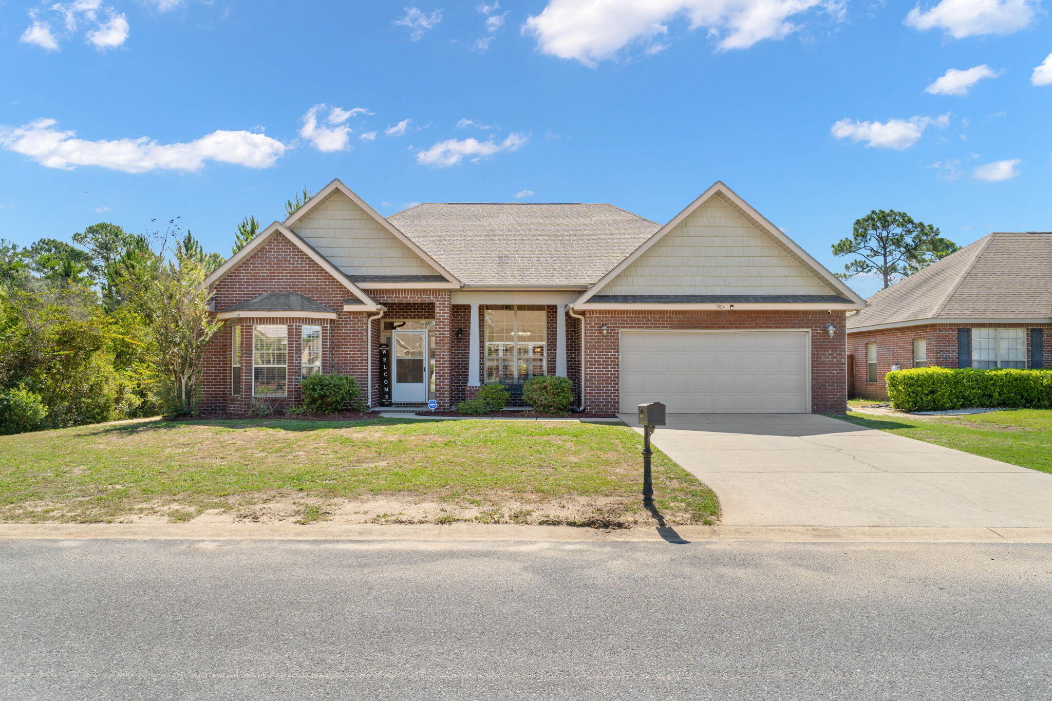 *Back on the market due to no fault of the sellers!* Welcome home to this beautiful Navarre home featuring 3 bedrooms plus a bonus room/office and a formal dining room space in a great neighborhood with no HOA! Enjoy this meticulously maintained craftsman style all brick home where you'll enjoy custom touches like trey ceilings, vaulted ceilings, crown molding, and beautiful archways along with stunning mahogany wood floors in main living areas. Enter in the front door and you're greeted by a fantastic foyer space; to the left is the bonus room/office and to the right is the formal dining room area (perfect for another flex space if a formal dining room isn't needed!) and the spacious living room is open to the well appointed kitchen. Featuring an eat in kitchen space you'll find granite countertops, tasteful backsplash, tons of cabinet space, and recessed lighting with drop down pendants over the hop up bar. The primary bedroom is an impressive retreat!! You'll love coming home to this spacious space complete with a trey ceiling and an additional 7x10 sitting room with a door that leads to the back patio. The en suite features double vanities, a walk in tiled shower, separate jetted soaking tub, private water closet, and a massive roughly 10x10 walk-in closet. On the other side of the house you'll find two nice sized bedrooms with ample closet space and a full bathroom between them along with an interior laundry room. Outside you'll find a wonderful screened in back patio overlooking the back deck complete with trex decking. You will love entertaining in this space and enjoying your private backyard! Enjoy a short commute to Hurlburt Field and being only minutes to gorgeous Navarre Beach and everything it has to offer! (survey and inspections available!)