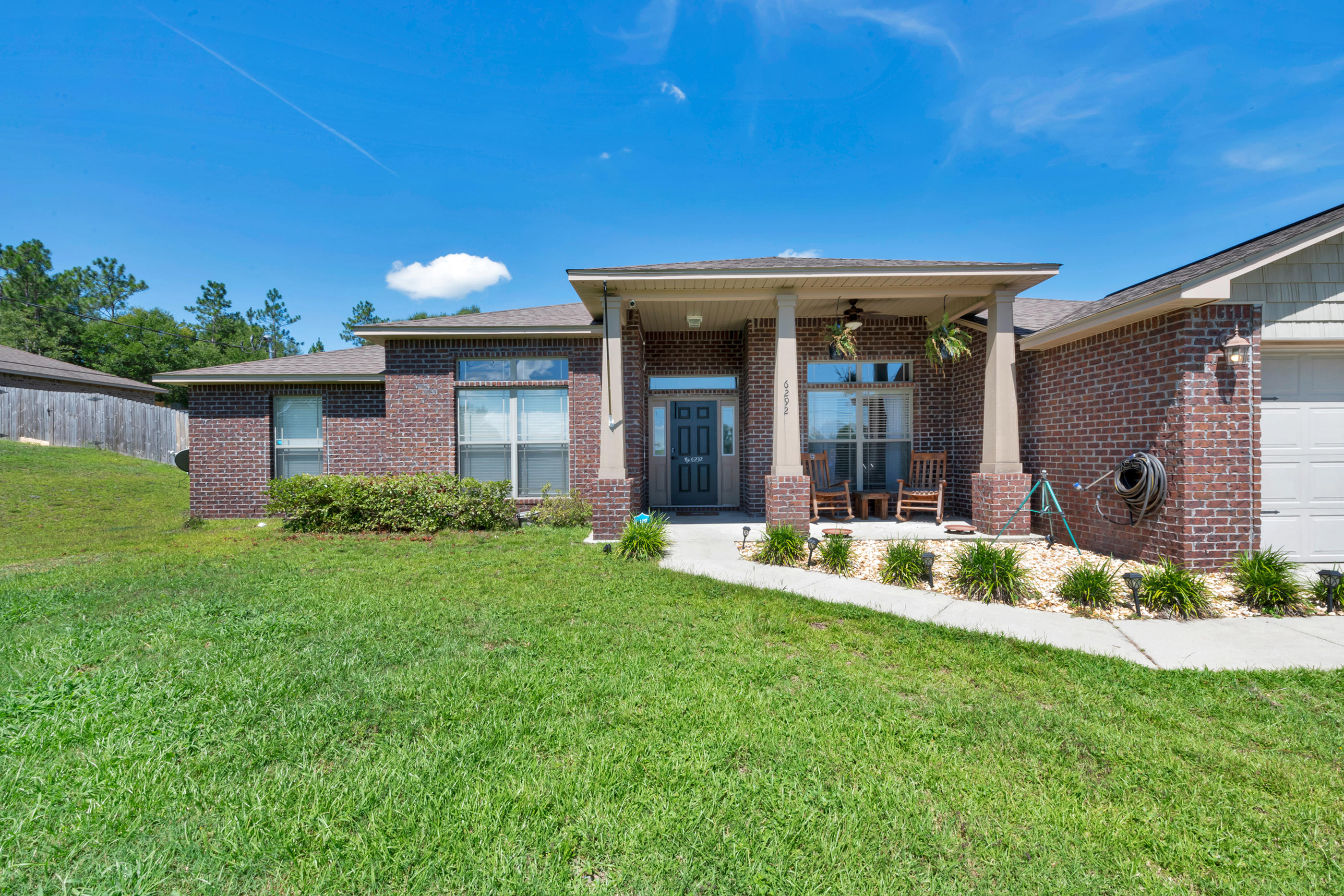 Beautiful 4BR/2BA brick home on large .62 acre lot.  The covered front porch welcomes you into this lovely home.  This split bedroom plan features bamboo, tile floors with carpet in bedrooms.  In the roomy kitchen there is granite countertops, stainless steel appliances, a center island and breakfast bar.  There is also a separate breakfast room and formal dining room.  You will find plenty of space to accommodate large furniture in the master bedroom.  The master bath has a soaking garden tub, separate shower and 2 walk in closets. The 3 spacious additional bedrooms share a full bathroom.  French doors just off the great room lead you to the open, oversized back patio.  The backyard has a privacy fence and lots of space.  Come see it for yourself!
