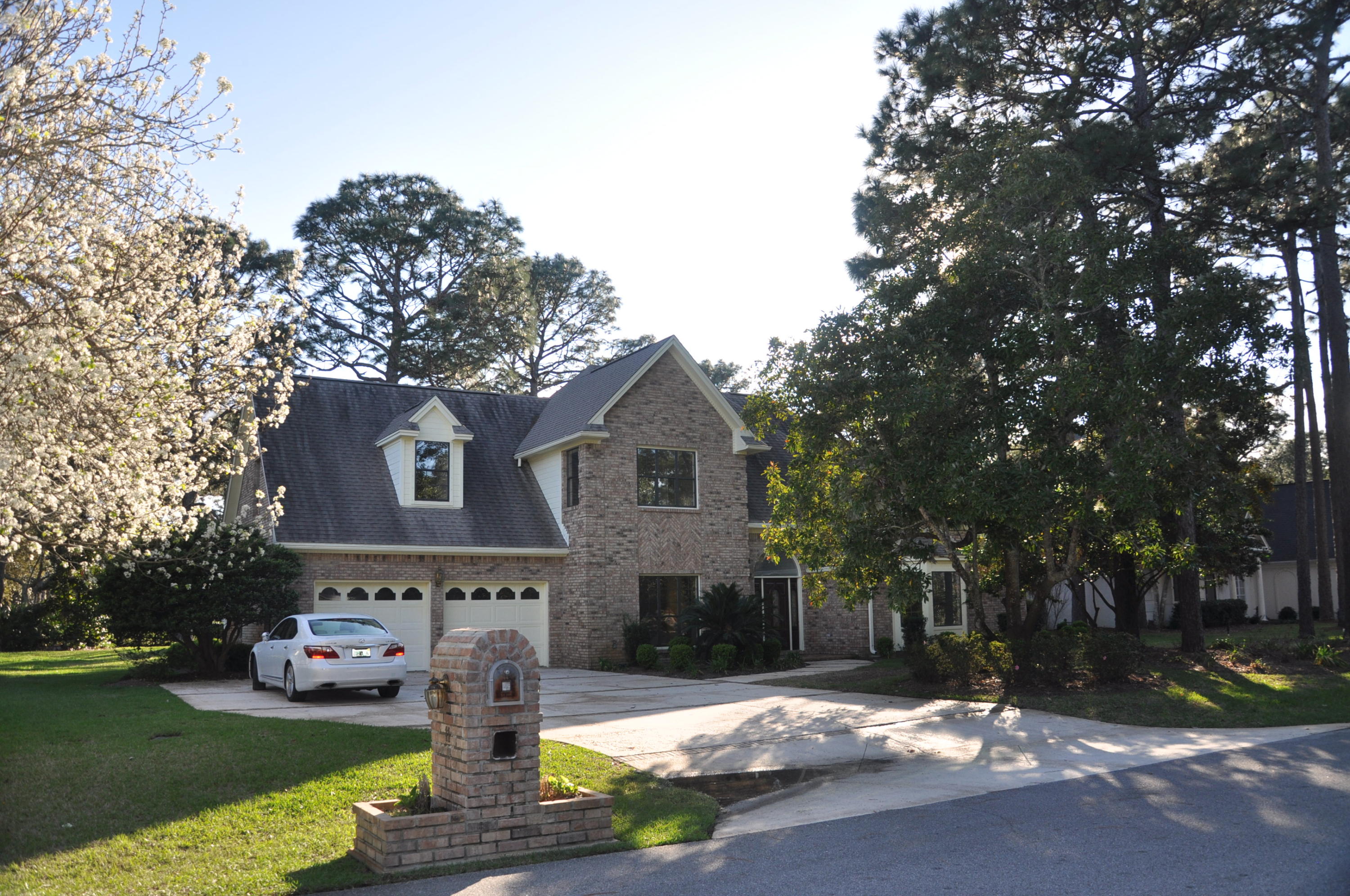 Comfortable, large, brick 4 bedroom, 2.5 bathroom home on the golf course in popular Southwind section of Bluewater Bay - a gated community of upscale homes. Impressive front door & entry that opens into large and very tall family room with gas log fireplace. Second living area on right. Two HVAC systems. Spacious master bedroom and master bath on first floor. Larger kitchen and formal dining room. Kitchen eating area looks out to the golf course. Laundry chute in second floor bath. Large covered porch with overhead fans. Over sized garage has fixed storage cabinets, workbench and two storage areas above. Nicely landscaped yard with lawn pump for irrigation. Complete interior new paint. New carpet entire 1st floor living areas & master bedroom. Large driveway for added parking. Vacant and ready for  a new family.  Take a look today.