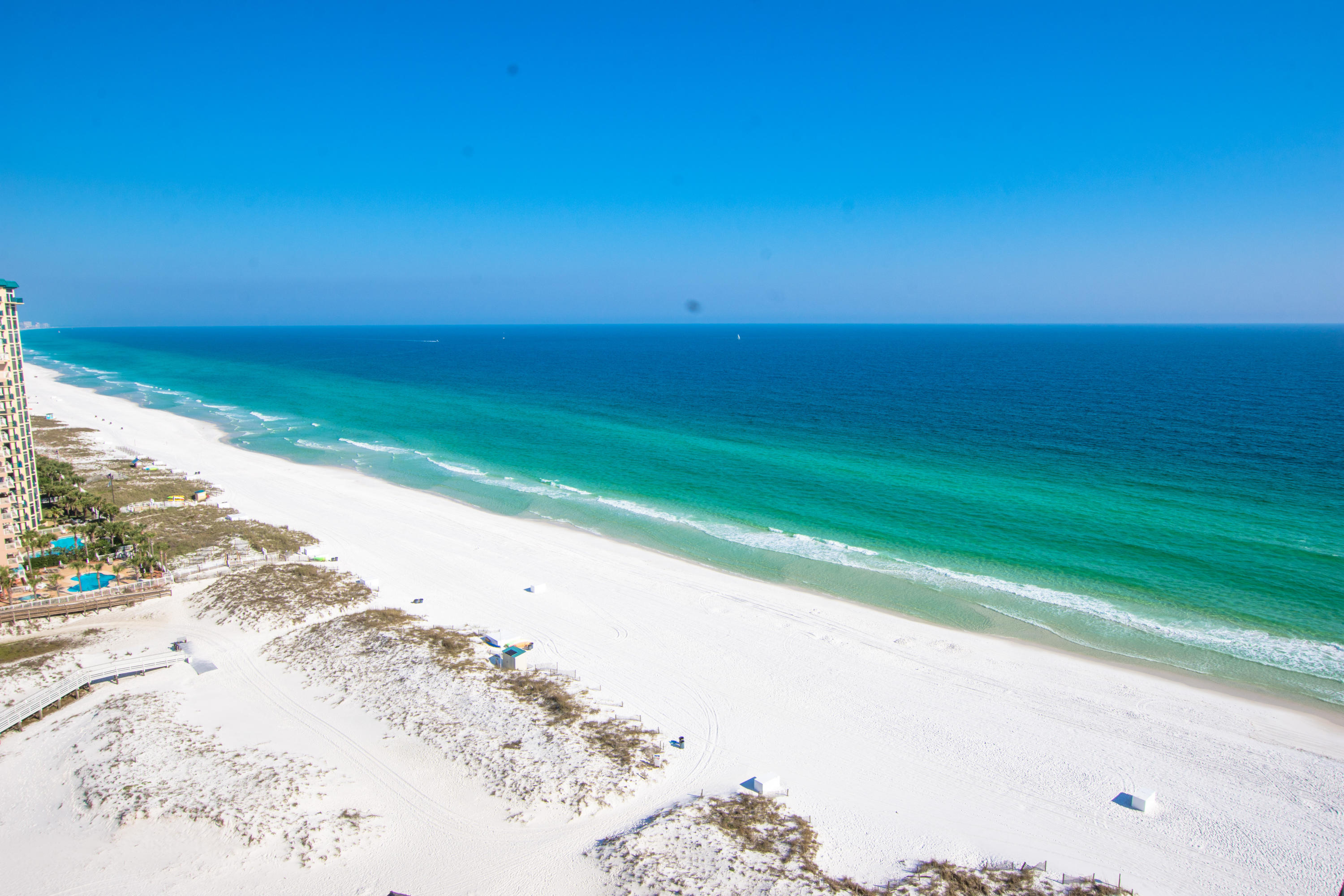 Known for achieving some of the top rental figures on the beach, (rental projection up to mid $50K!) Pelican Beach is located on the famed beaches of Destin...which conjures up images of sun-splashed days of swimming, biking and relaxing. Revel in this super spacious 2 bedroom, 2 bath condo in the highly desired 12 stack! This condo has a fully stocked renovated kitchen, Gulf front living room and master suite both with balcony access, large dining area, guest bedroom, balcony with storage closet and washer/dryer inside the condo. Stunning Gulf views and breezes from your supersized balcony. This condo is carpet free - tile floors throughout! The kitchen has updated cabinetry, stainless steel appliances and granite counters. This stunning condo conveys fully furnished and rental equipped. Pelican Beach Resort is centrally located to all the dining and entertainment Destin is famous for including spas, shopping, golf, fishing and more! A huge new resort style zero entry pool and spa + sundeck is under construction and will be open Summer 2020, in addition to the other amazing resort style amenities, including: three swimming pools including an indoor/outdoor swim through pool and a kiddie pool, tennis, hot tub, huge sun deck, beachfront grill, fitness center, building security system with cameras, upgraded cable and super high speed internet, on-site cafe and market, 24 hour reservation desk, secured entry with guard shack, convention/meeting services and covered parking garage!
**HOA fees have increased from 490.93 to 663.57 for a period of 3 years to pay for the new amenities**

**All information to be verified by buyer**