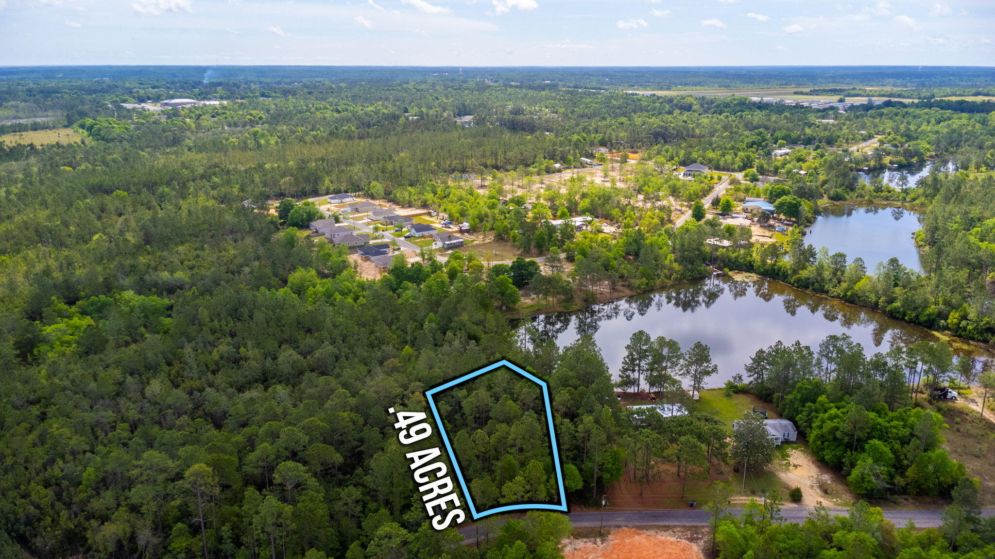 (Lot has been mulched since the aerial photos were done)  .49 of an acre sitting on one of the many lakes in Oakwood Lakes Estates. This lot still offers plenty of room to build or put your manufactured home outside of the flood area. There are minimal restrictions & no HOA fees. Electric & city water are available but the tap fee is due. Private septic would need to be installed as there is no public sewer available in this area. Give us a call today to invest in this property before it's gone.