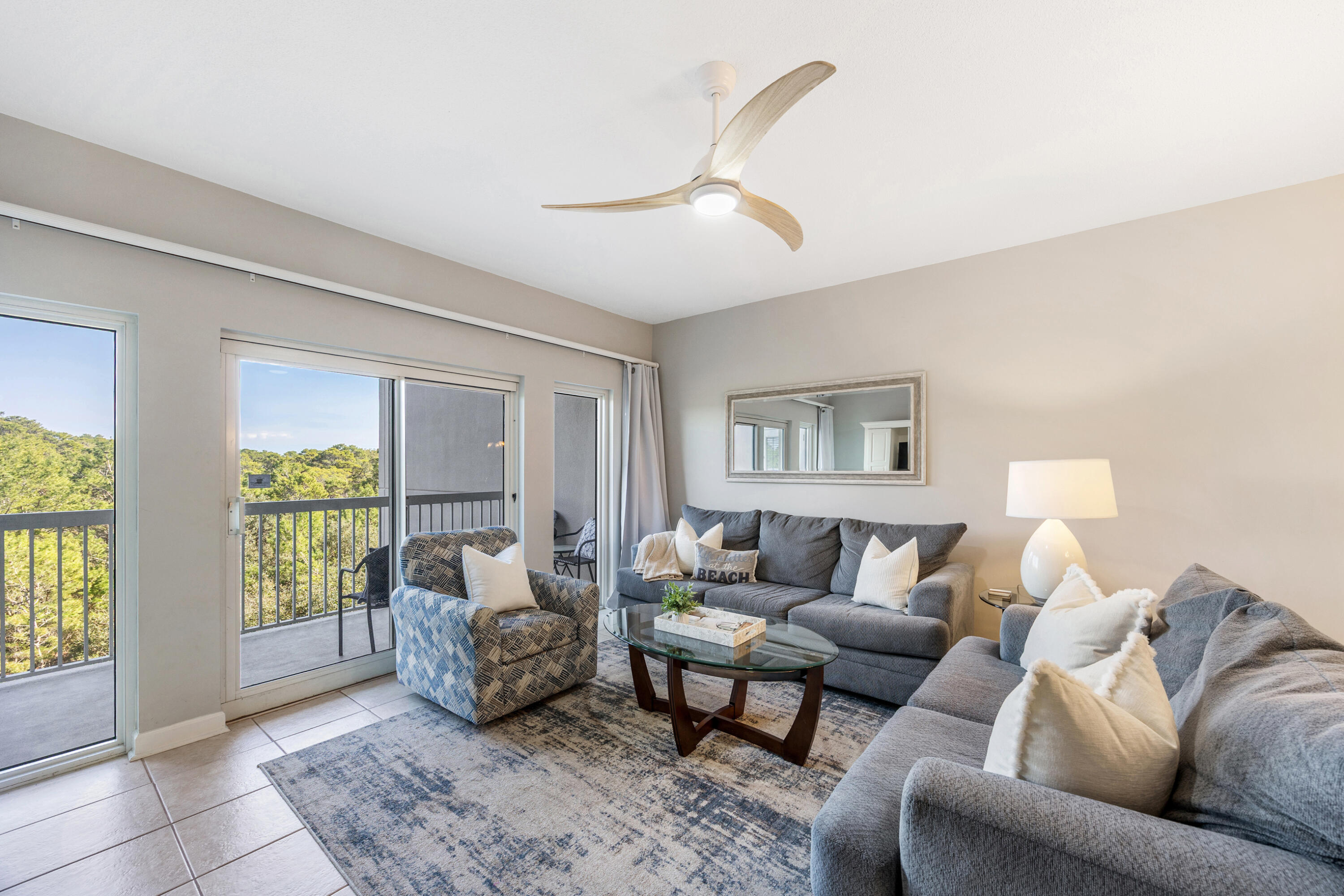 BEST PRICED unit at Tops'l Resort! Enjoy peaceful views and an unbeatable location in this beautifully priced 2-bedroom, 2-bath condo overlooking the serene nature preserve of Topsail Hill Preserve State Park. Nestled within the prestigious gated community of Tops'l Beach & Racquet Resort, this east-facing unit offers a tranquil setting where you can sip your morning coffee while watching deer & other wildlife from your private balcony, accessible from both the living area & the primary suite. The interior features granite in both the kitchen & baths, and a bright open concept layout with tile flooring throughout for low-maintenance beach living! Three brand new fans were just installed for a more modernized feel. Sold fully furnished. The cheerful kitchen includes stainless steel appliances, granite countertops, ample cabinetry, a pantry/owner's closet, and a breakfast bar ideal for casual dining. The kitchen and dining area also captures calming nature views.

The spacious primary suite features a king bed, balcony access, and large windows that bring in great natural light & peaceful views. The ensuite bathroom is complete with granite vanity and updated walk-in tile shower with glass surround. The guest bedroom offers a queen bed and a twin bed to maximize rentals. The split-bedroom layout is ideal for added privacy, plus flat screen TVs in both rooms and brand new fans that modernize it. A second full bath features a granite vanity and nice tub with tile above and glass door. There is a stackable washer/dryer to complete the space. The unit was recently staged for a more coastal feel and can convey for just $1,000 at closing (to agent). 

Owners and guests at The Summit enjoy exclusive access to its private pool, hot tub, and BBQ area, as well as the world-class amenities of Tops'l Beach & Racquet Resort. Highlights include 600 feet of private beach, a beachfront pool and tiki bar, basketball, shuffleboard, mini golf, and three on-site restaurants all on 52 acres of lush, Gulf-front property. Tops'l Resort also features 12 amazing Rubico lighted tennis courts and newly added pickleball, for an additional fee. If you become a Tops'l Club member, you can also have access to a great fitness center with locker rooms, steam & sauna, hot tub and indoor/outdoor pool. Whether you're looking for a full-time residence, vacation retreat, or income-generating investment, this condo at The Summit checks all the boxes in a truly one-of-a-kind coastal setting.
