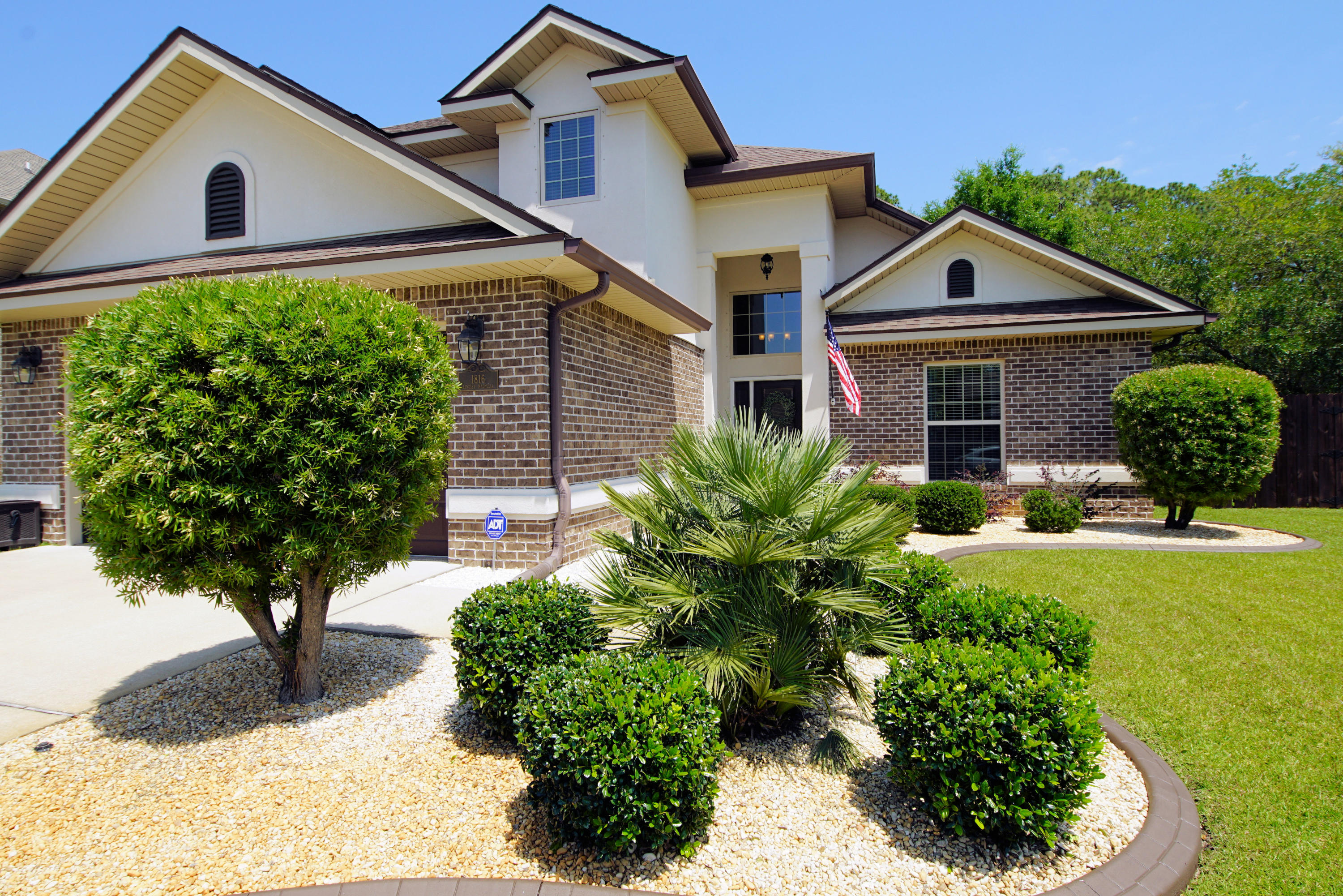 Pristine brick (with stucco accents) home in coveted Private Magnolia Village. Stunning curb appeal. Launch a kayak or paddle board; water access just minutes away at end of Joybrook Road. Two story with Master on first floor and two additional bedrooms on second floor. Open Flex Room on second floor could easily be a Fourth Bedroom. Cathedral ceilings, fireplace with shelving, and dark high-end laminate flooring add beauty to the open Living/Dining area. Kitchen and baths feature granite counters and oiled bronze faucets/accessories. Lovely off-white Cabinetry (glass fronts on some), Stainless Appliances, and pantry are features of Light and Spacious kitchen. Enjoy summer breezes relaxing on covered patio in privacy fenced back yard. Epoxy flooring in Garage in this Immaculate Home.