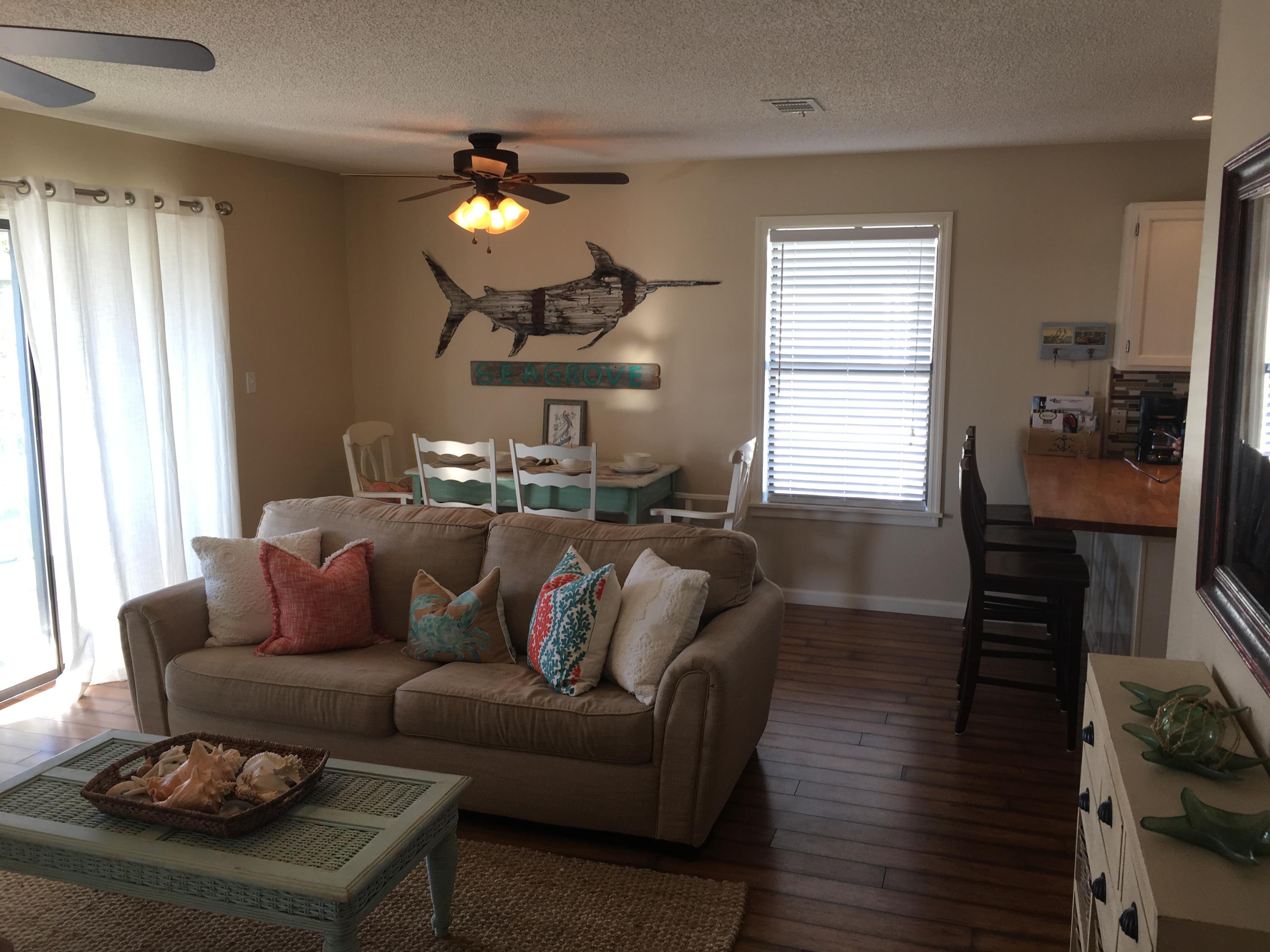 Beautifully furnished 3 bedroom 2 bath condo located in Beachwood Villas. The unit is located in the most secluded area of project. The unit has a deluxe balcony with entrances from both living room and master bedroom. Large private balcony is one of very few that does not face other balconies. Beachwood Villas Homeowners Assn. is known throughout 30-A as one of the best maintained and meticulously manicured projects in the area. Although this unit was never on a rental program, low HOA fees, 3 bedrooms and furnished make this unit a turnkey investment or second home. Flat screen tv's and beachy decor throughout unit. The community pools, lighted tennis courts, fenced in playground, shuffleboard and grilling all add to the wonderful appeal of this great community This unit is on the 3rd Floor with balcony in the palms.  Being on the 3rd floor has its advantages.  The 3rd floor always has a comfortable breeze when sitting on the balcony.  The 3rd floor has no unit above, in front, behind or on both sides.  The 3rd floor is the quiet floor.  There is no foot traffic to deal with because your the only unit at the top of the stairs.  Also, no views of everyones bicycles stored on first floor.  

This unit location is perfect for parking your car and walking or biking for the rest of your stay.  Tom Thumb for all conveniences, several restaurants and shopping just a short distance from your front door.