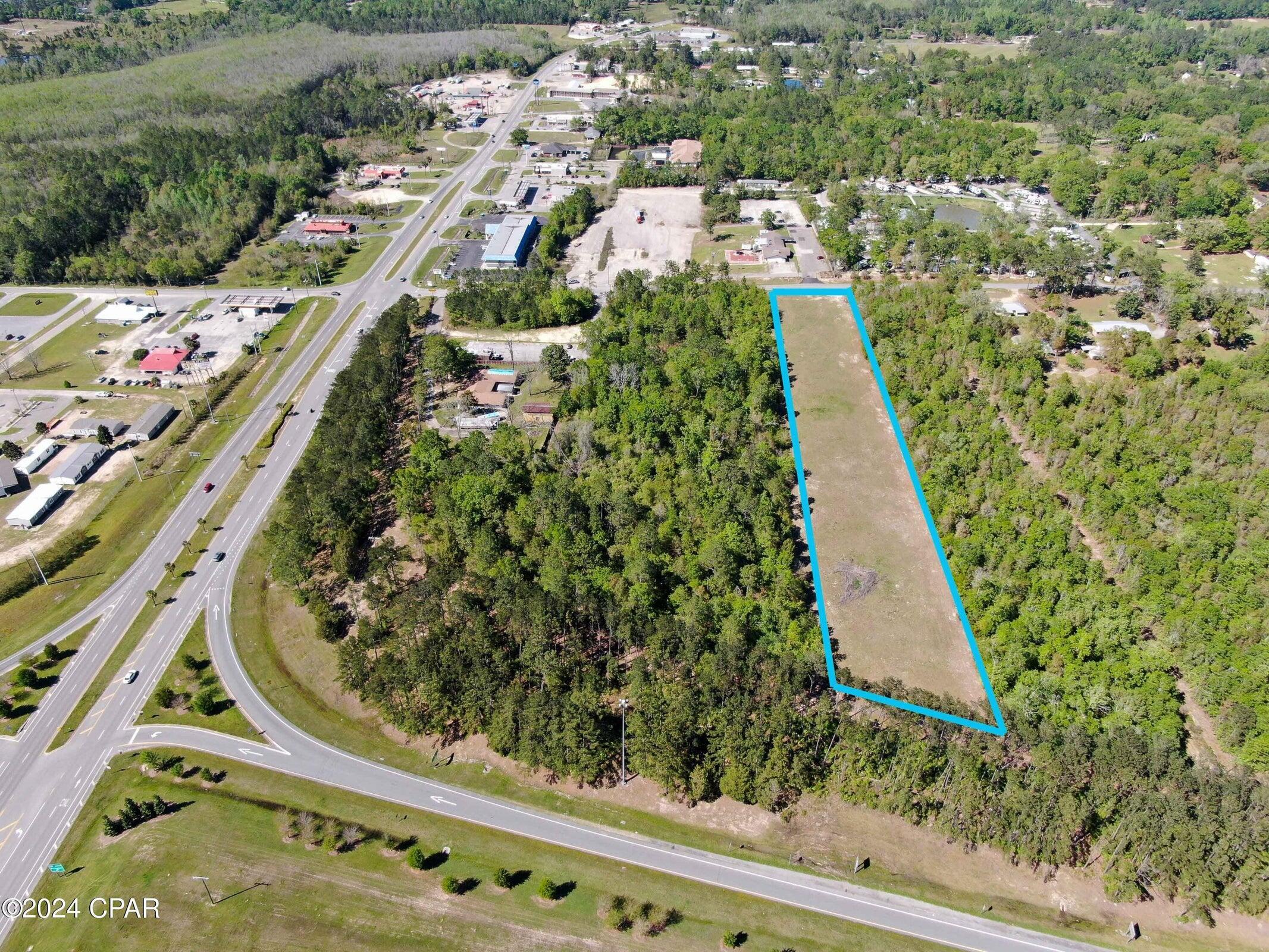 One of the true premier remaining 1-10 sites available. Amazing location in Bonifay. Adjacent 6 acres also available. Commercial is located in 5.1.j, and allows for a wide range of commercial uses, but not residential uses. The 'commercial' land use category is designed for a wide range of business uses, including retail, wholesale, communication facilities, light industrial, offices, and professional services. Residential uses are not allowable, except as incidental or accessory uses. Commercial and business uses shall be limited to an impervious surface coverage of 90% and a floor to area ratio of 2.0. While commercial and business development may not exceed 90% impervious surface coverage the Gross Floor Area Ratio (FAR) of 2.0 shall also not be exceeded.