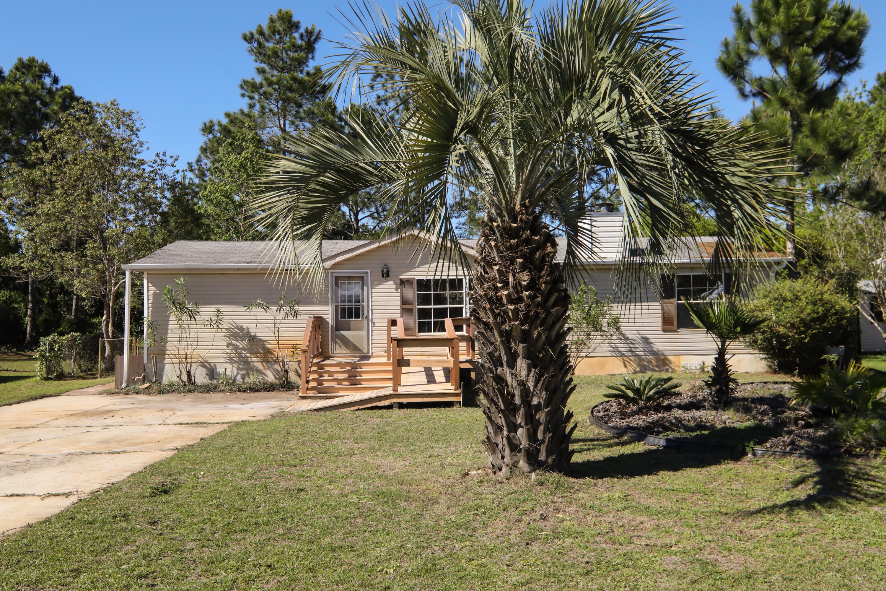 *Need Tlc*Back on market, act fast! Sold AS-IS. Lakefront mobile home nestled in a quiet subdivision! This home features a split bedroom floor plan, two bedrooms two full bathrooms, and beautiful lake views! With some TLC, this home will be great. Stainless steel appliance package is on order. The subdivision is located south of Highway 98 and is near the Ed Walline beach access, golf courses and shopping. Do not hesitate, call today to see this home! Any sheds, outbuildings, and lawn pumps are being sold in ''as is'' condition and no value will be added. Buyer to verify room measurements.